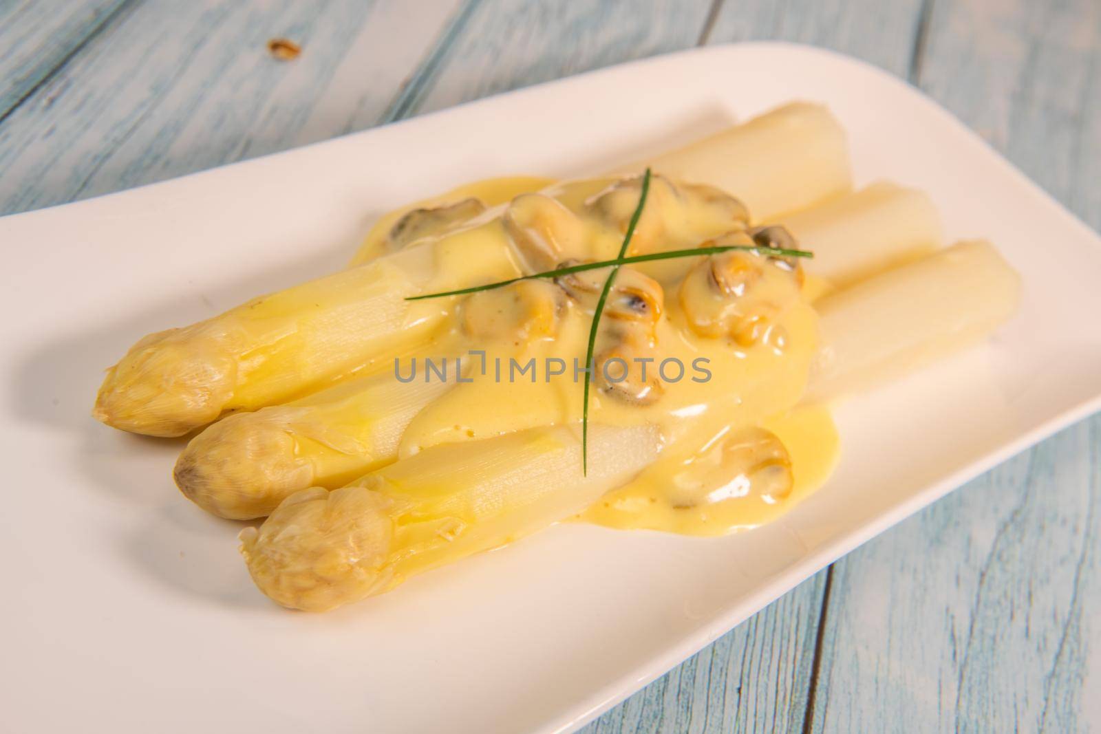 Large white asparagus and shell mousseline recipe. High quality photo