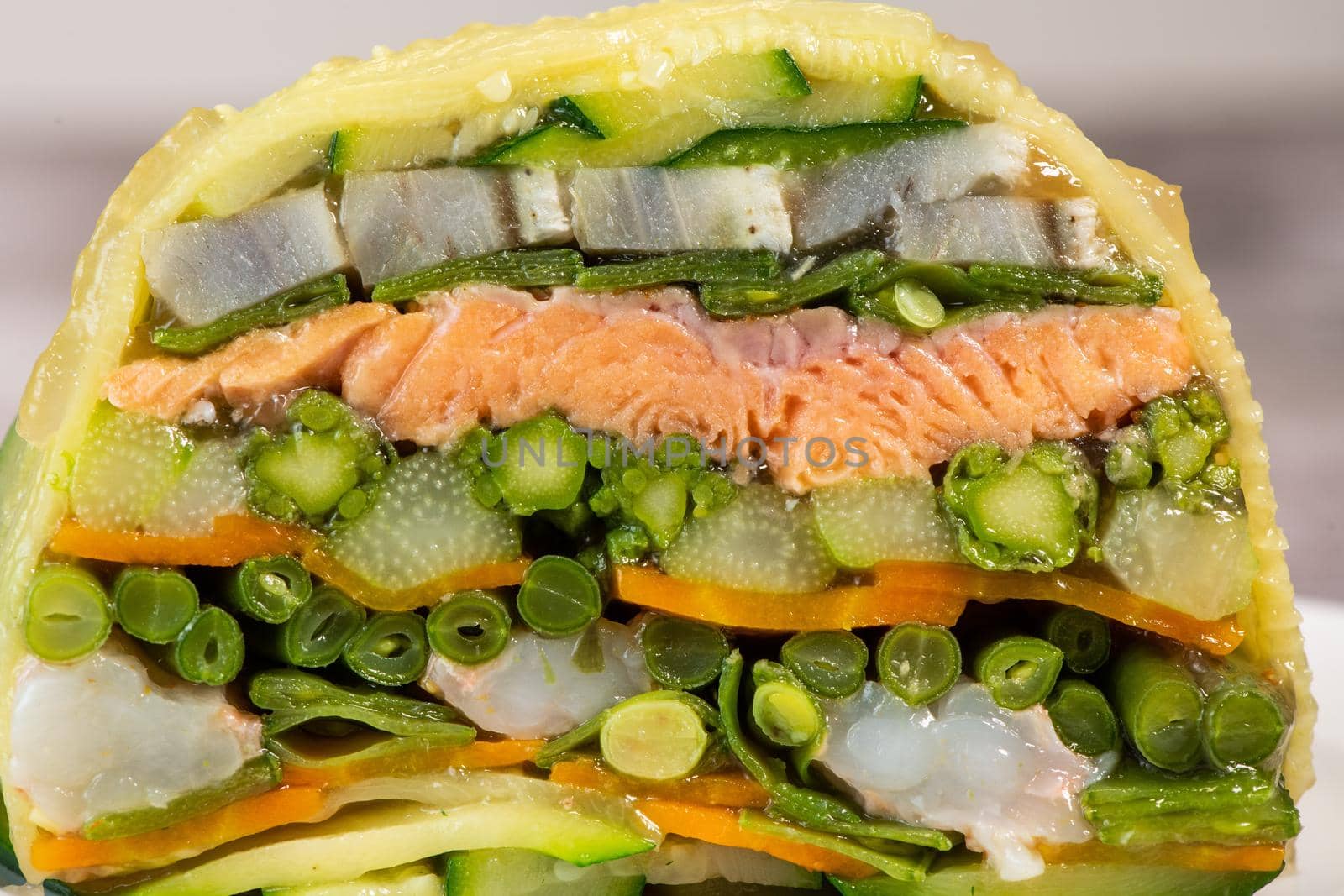 Recipe of marbled vegetables, salmon and langoustines, terrine salmon vegetables and langoustines. High quality photo