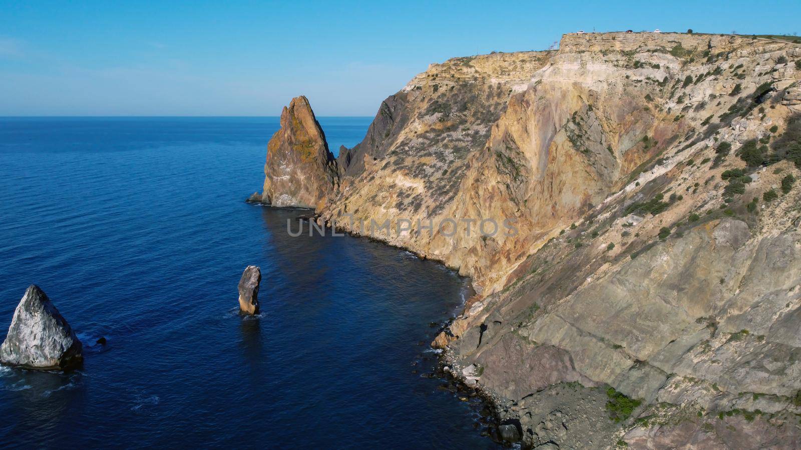 A panoramic ocean coast view with blue sky