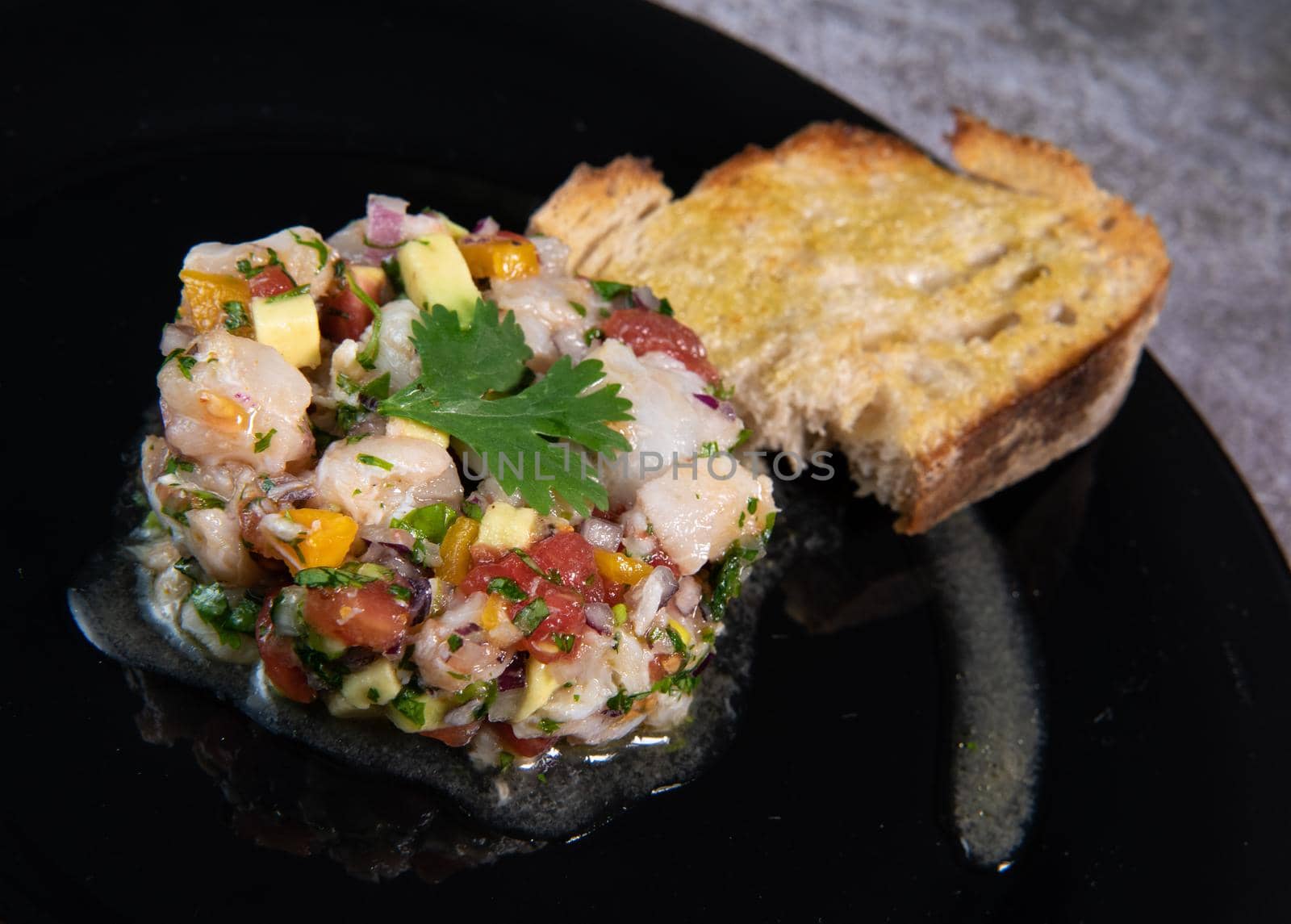 Cod Ceviche recipe, bread in oil and garlic. High quality photo