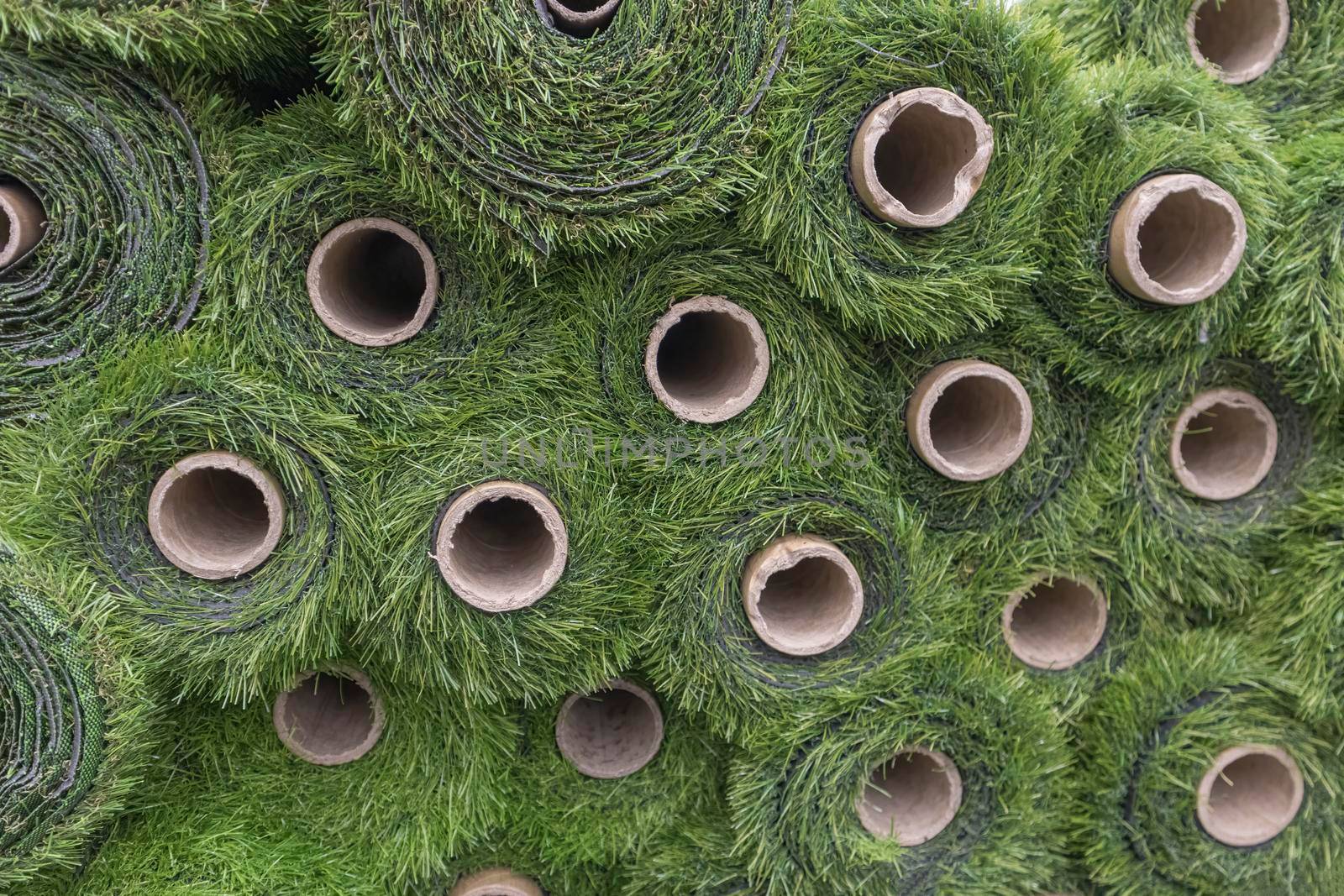 artificial grass in rolls lawn close-up as a background. High quality photo