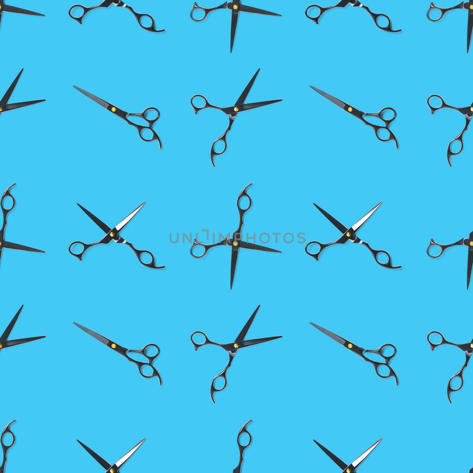 Seamless pattern of black scissors. professional hairdresser black scissors isolated on blue. Black barber scissors, close up. pop art background, for prints or posters