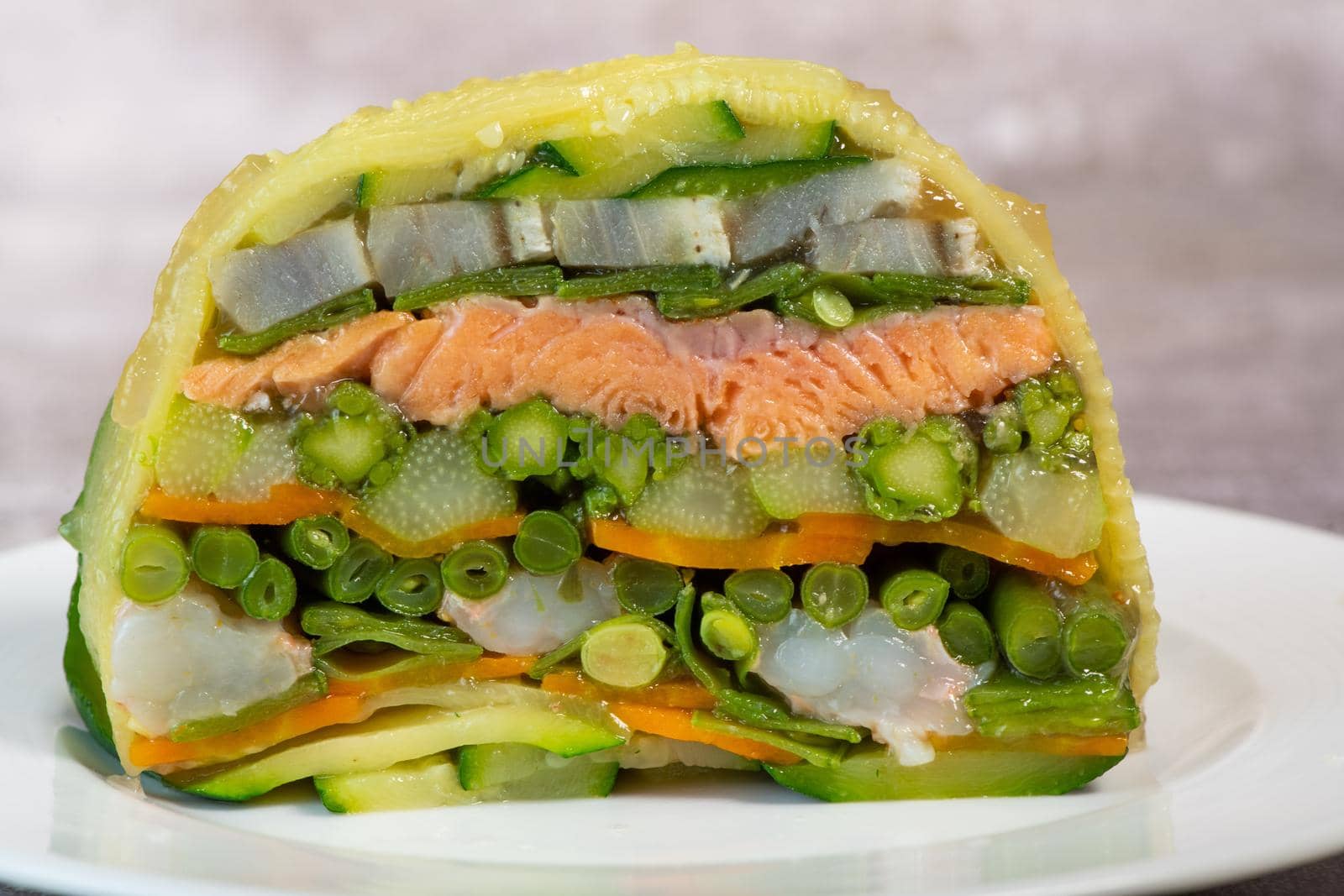 Recipe of marbled vegetables, salmon and langoustines, terrine salmon vegetables and langoustines. High quality photo