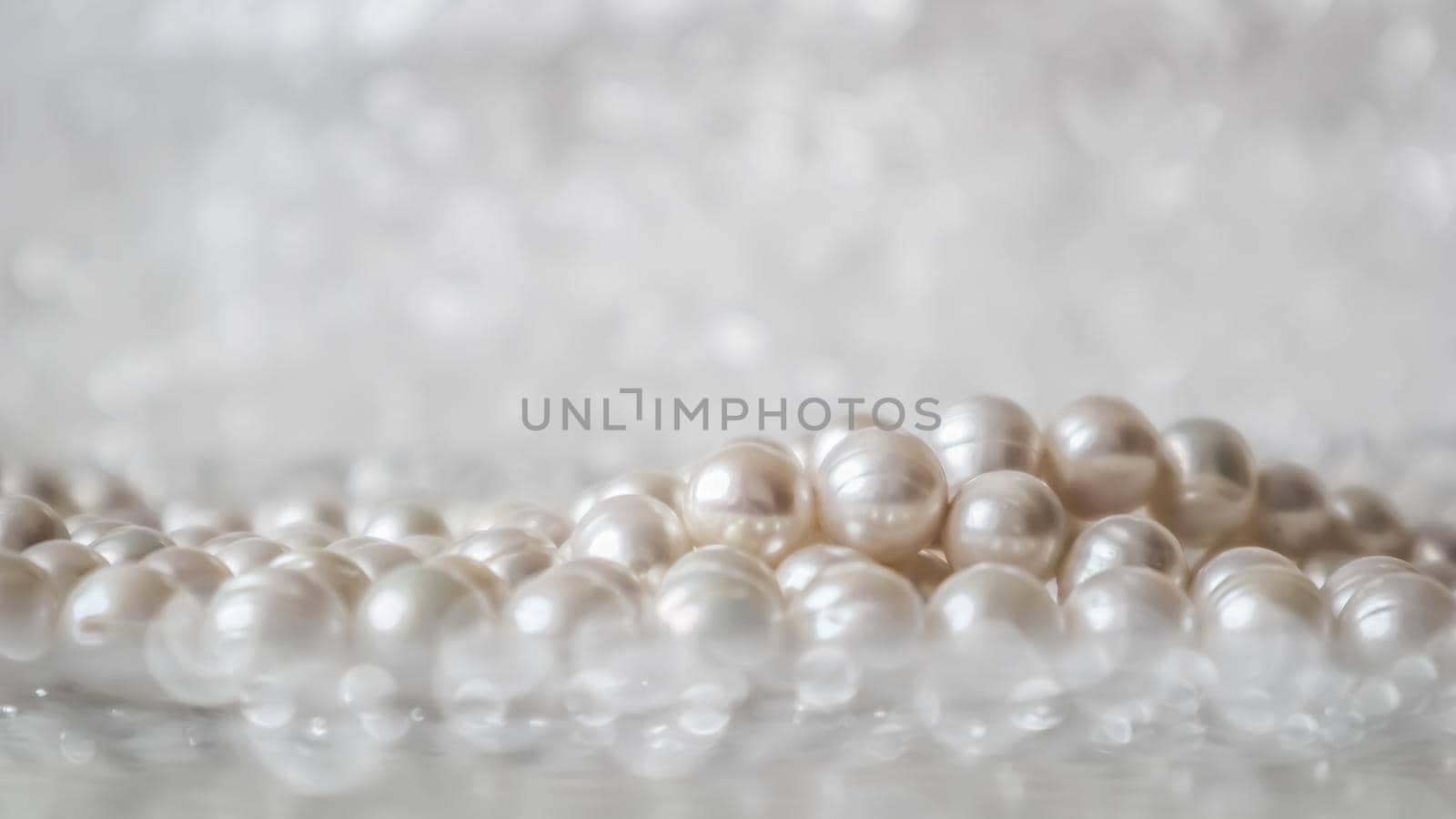 Nature white pearl beads on sparkling background