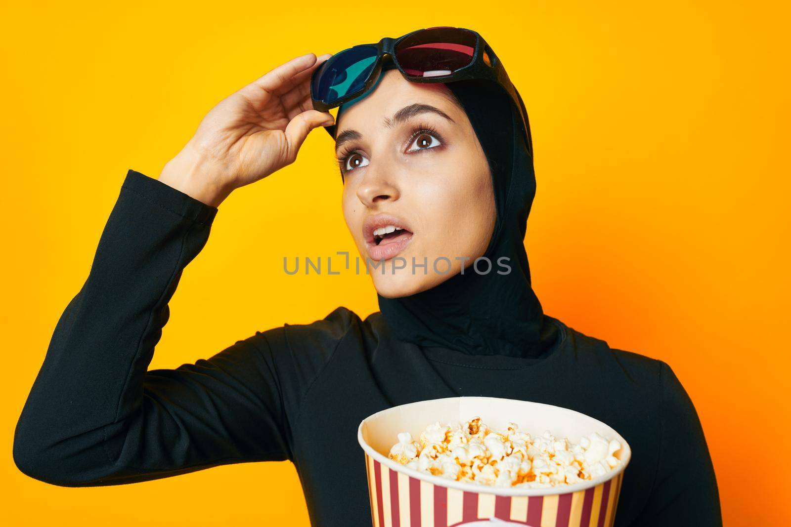 cheerful woman 3D glasses entertainment emotions yellow background. High quality photo