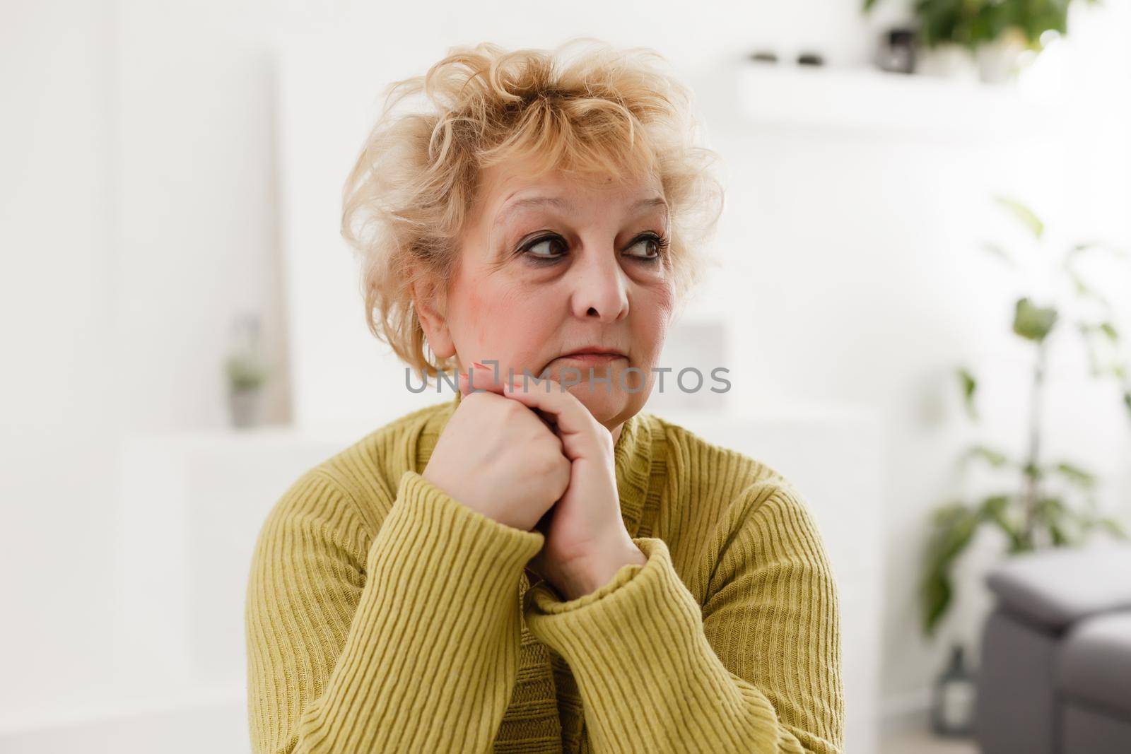 Close-up portrait of a senior woman in a medical mask. The use of the nebulizer.