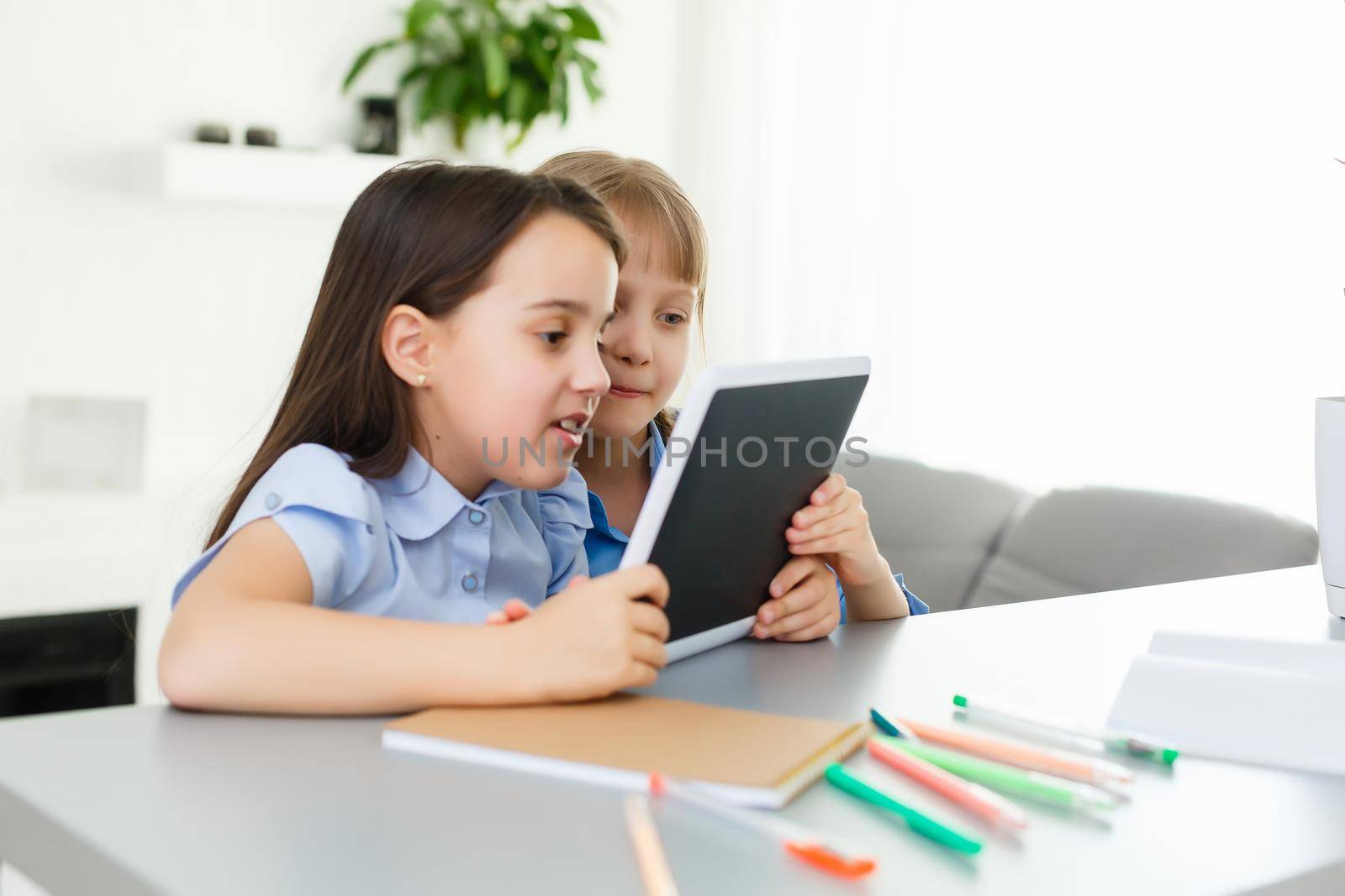 Learning from home, Home school kid concept. Little children study online learning from home with laptop. Quarantine and Social distancing concept. by Andelov13