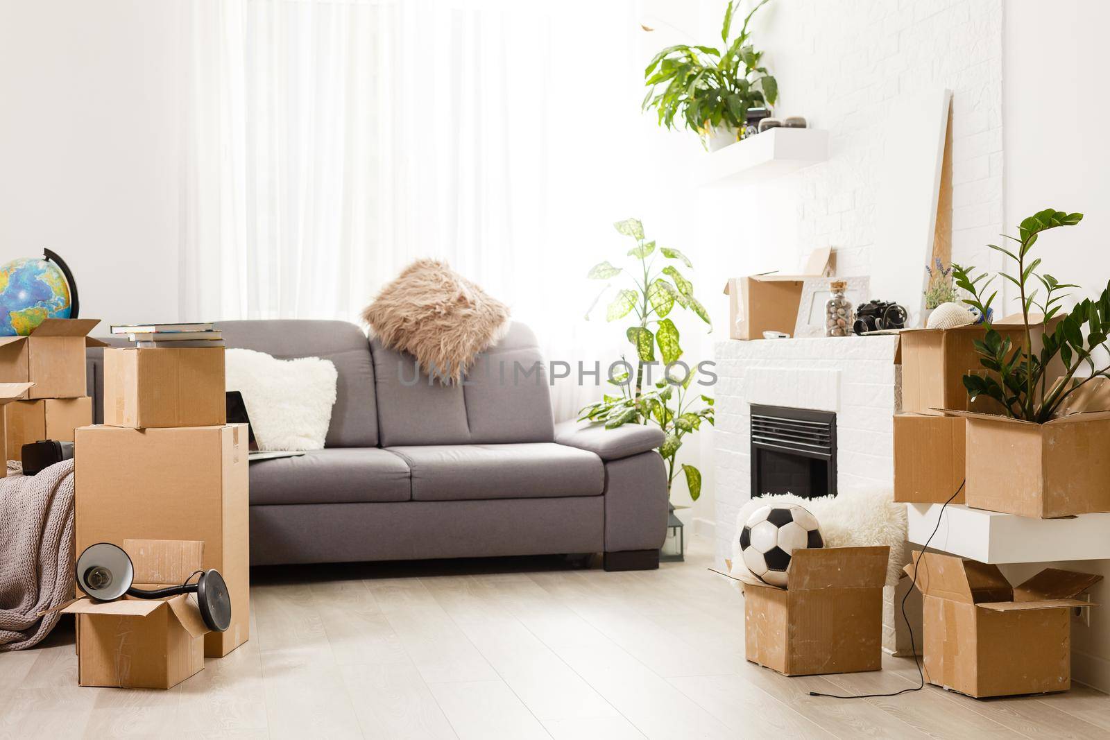 New home concept. Boxes in empty room.