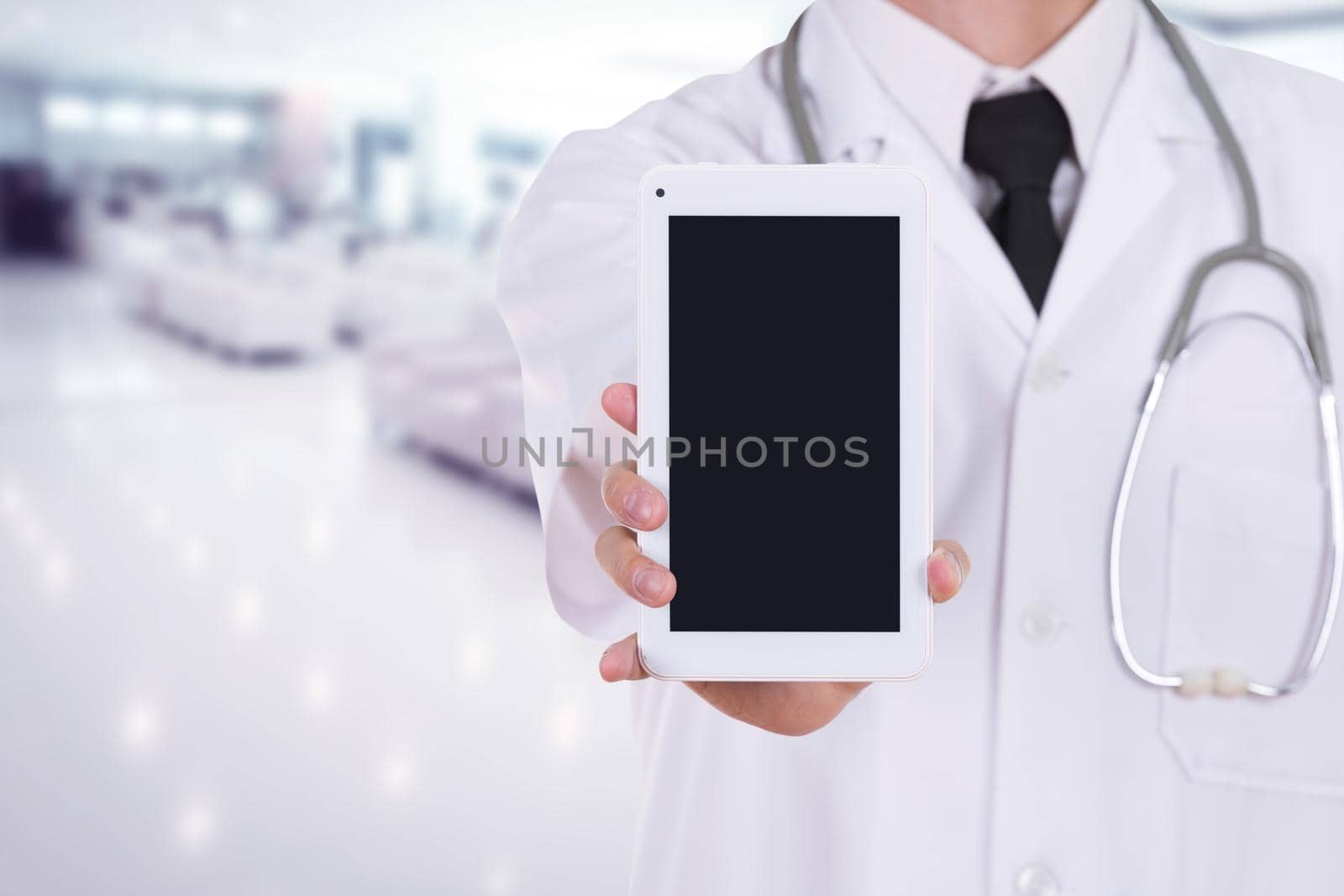 close-up doctor showing tablet computer blank screen in hospital