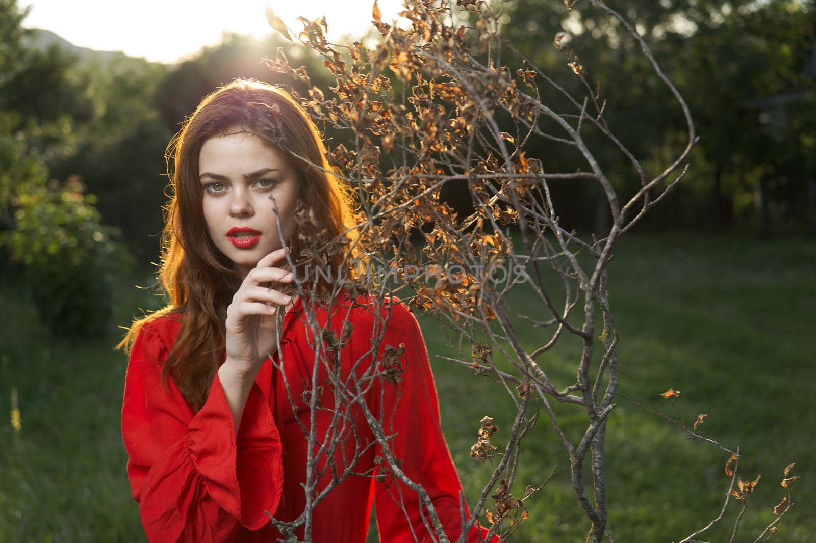 attractive woman in red dress outdoors fresh air summer by Vichizh