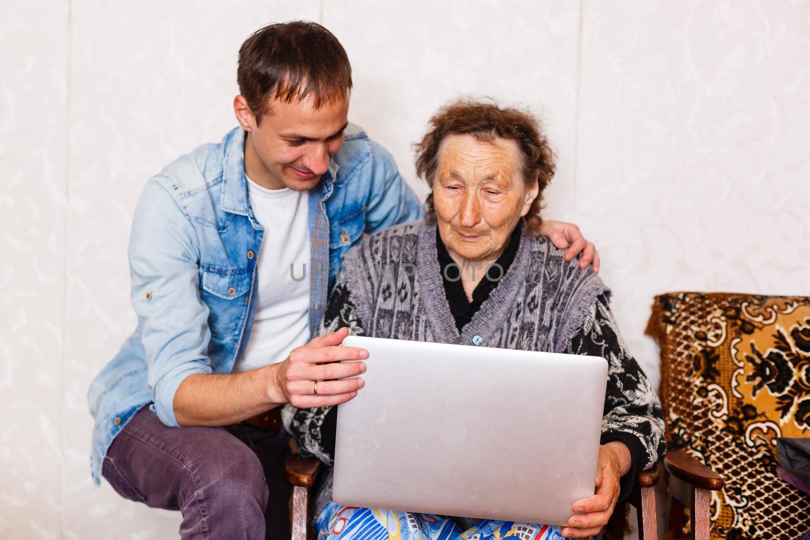 Closeup of elderly woman with young man