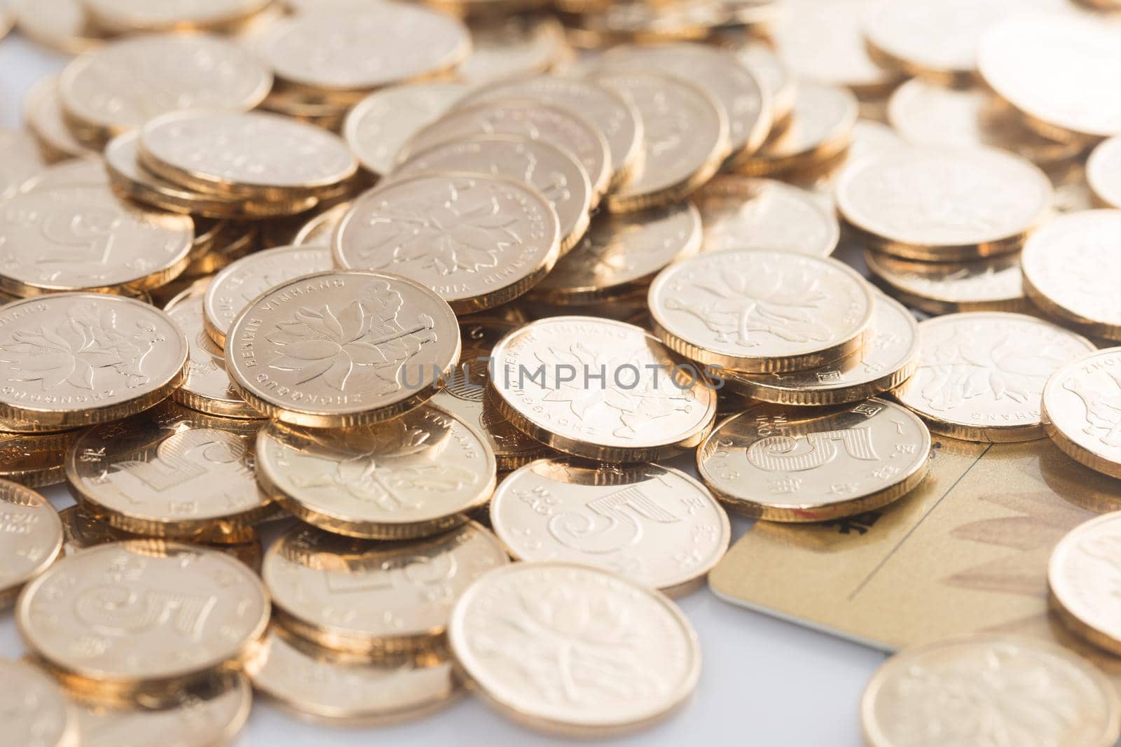 many coins on a white background for finance-about content