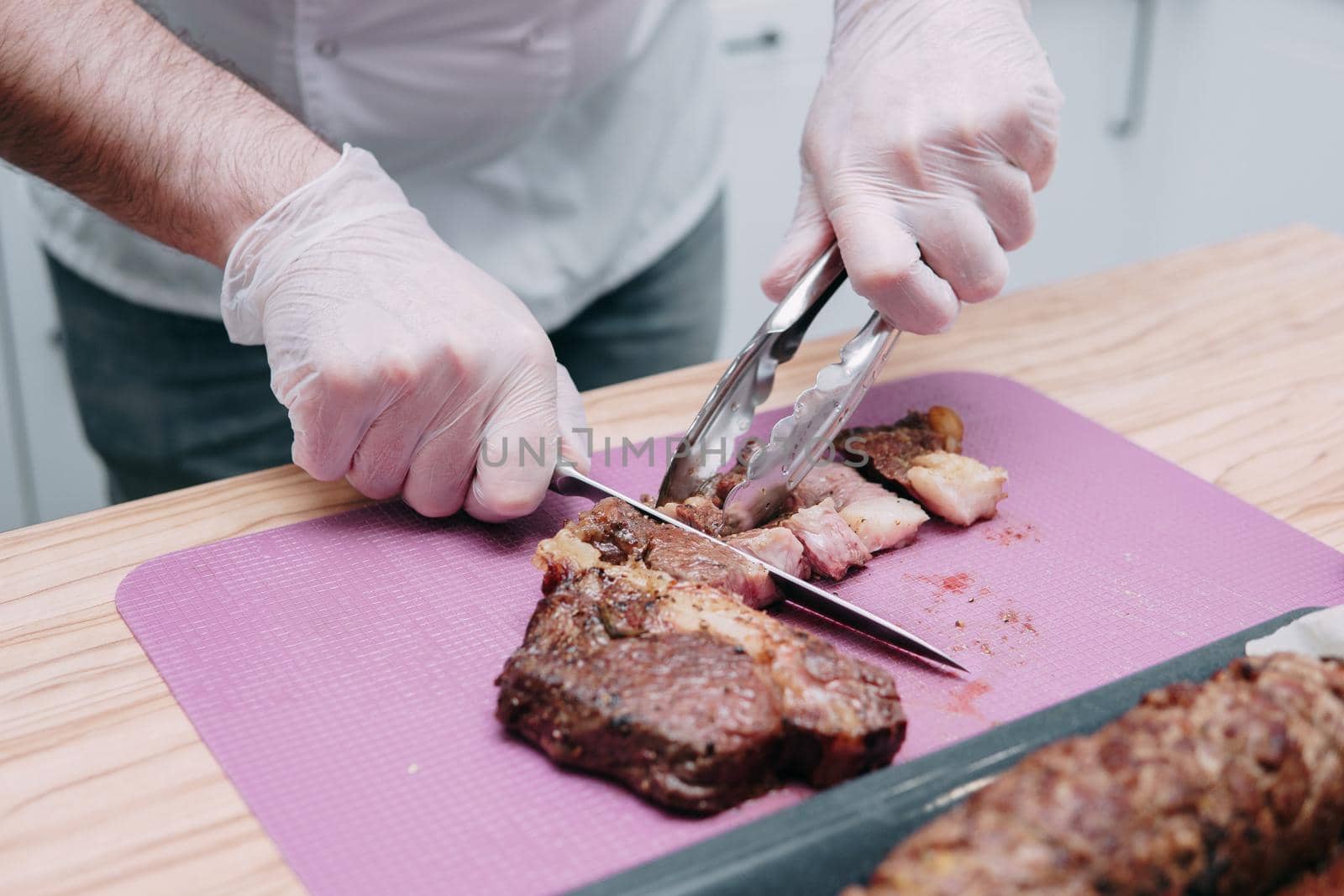 Cooking meat rolls in the cooking class. Beef roll with spices. The process of cutting a roll, close-up.