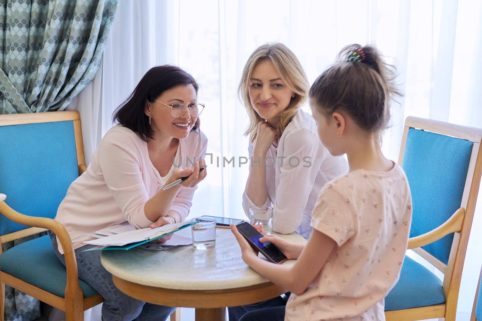 Mom and daughter preteen child at meeting with psychologist, therapist by VH-studio