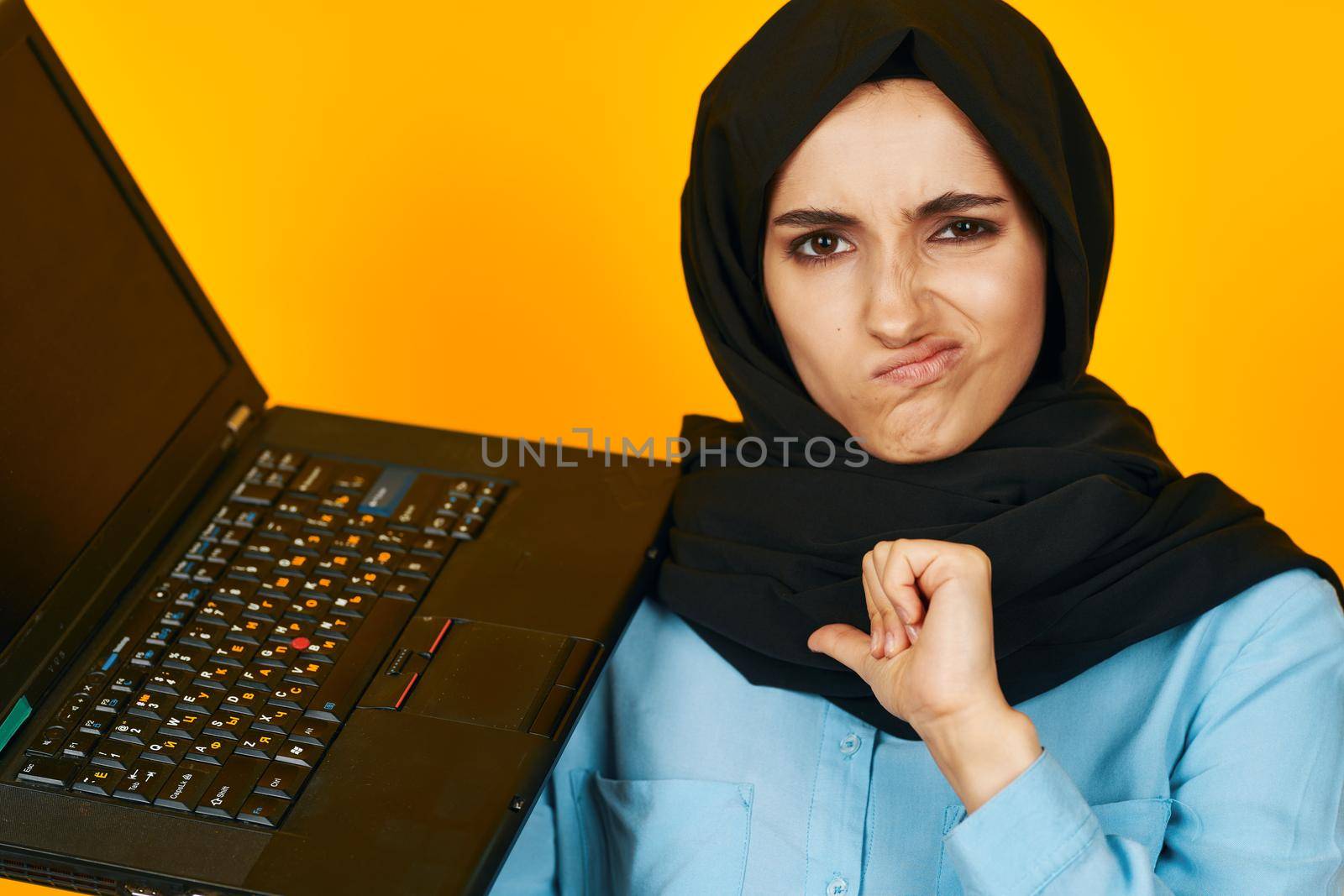 Muslim laptop posing technology internet studio lifestyle. High quality photo