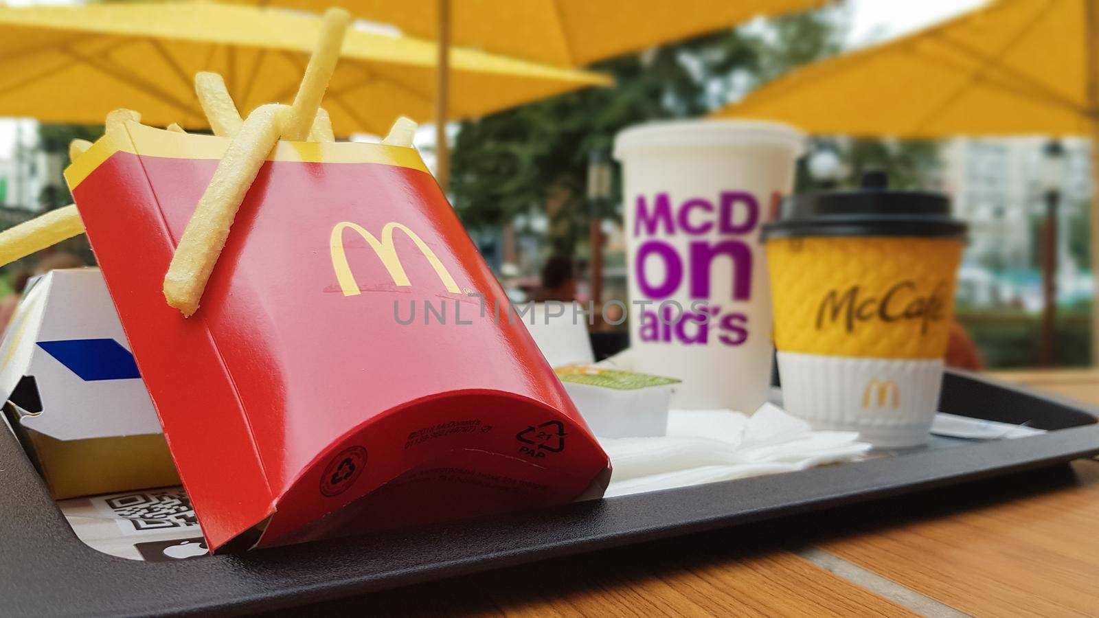 Hamburger, French fries, coffee and Coca Cola soft drink on the table in the McDonald's restaurant. Branches all over the world. Ukraine, Kiev - September 6, 2019