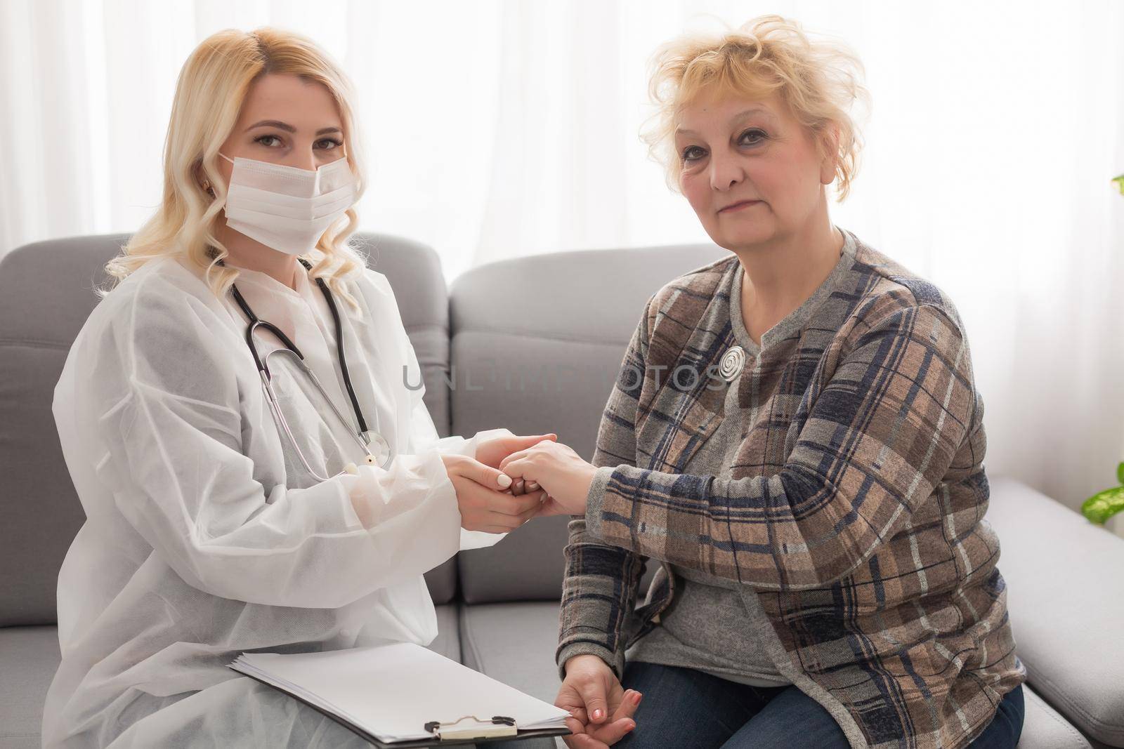 Senior woman with her home caregiver