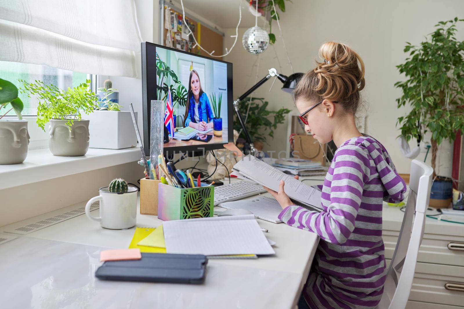 Girl child at home studying English language at home, online lesson by VH-studio