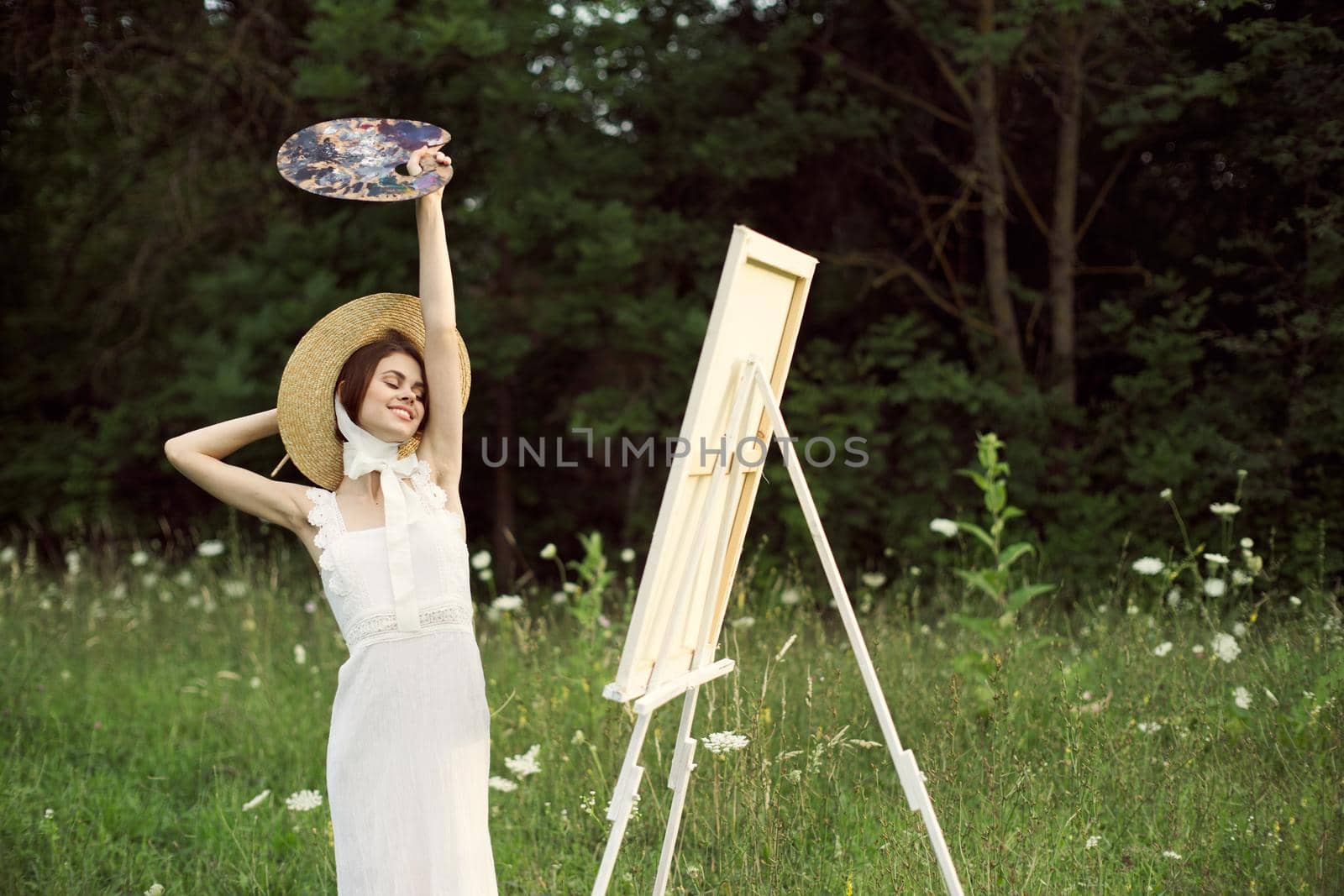 cheerful woman outdoors drawing art landscape hobby. High quality photo