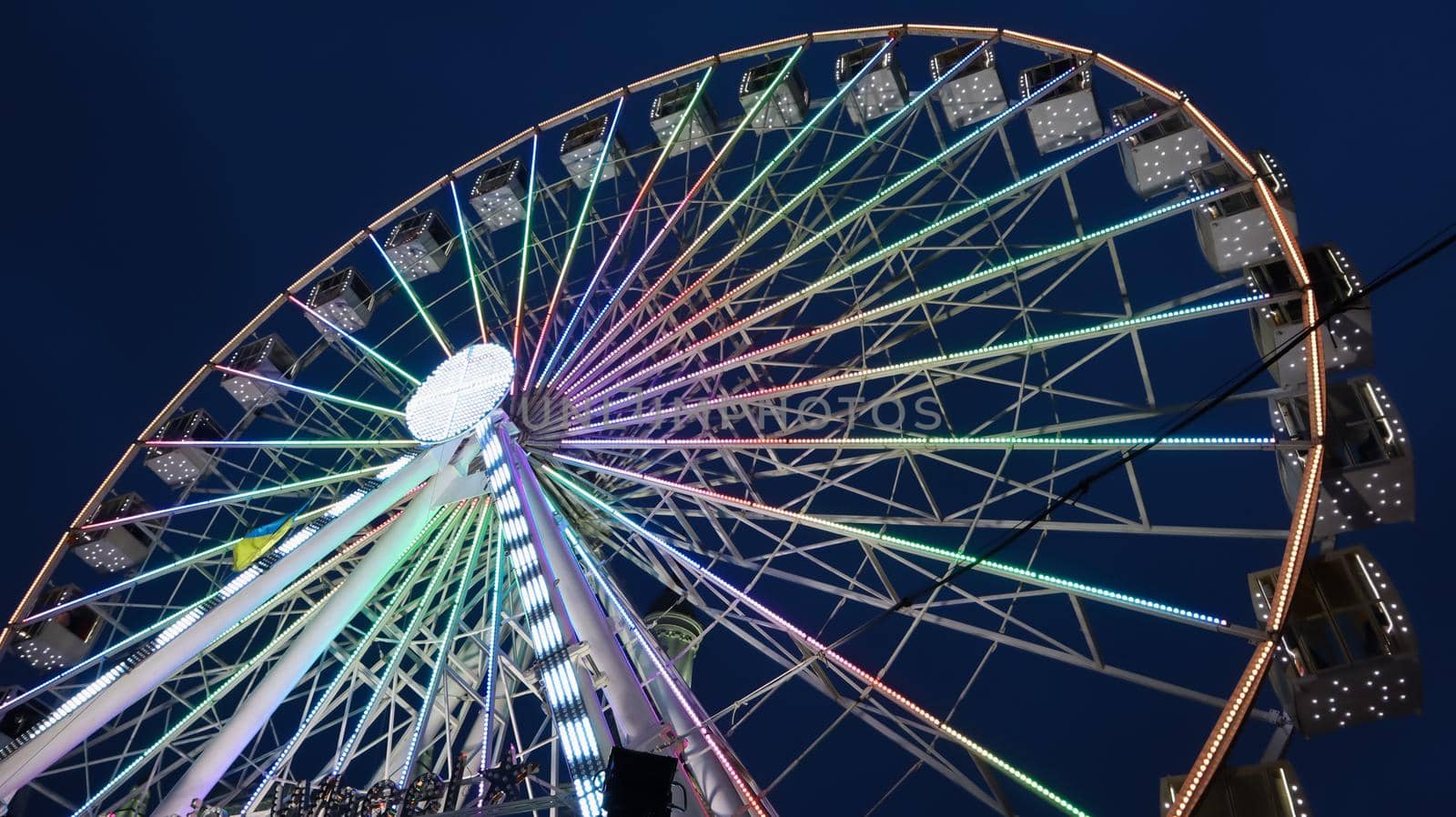 Ukraine, Kiev - January 15, 2019. Illuminated Ferris Wheel on Kontraktova Square in Kiev in the evening