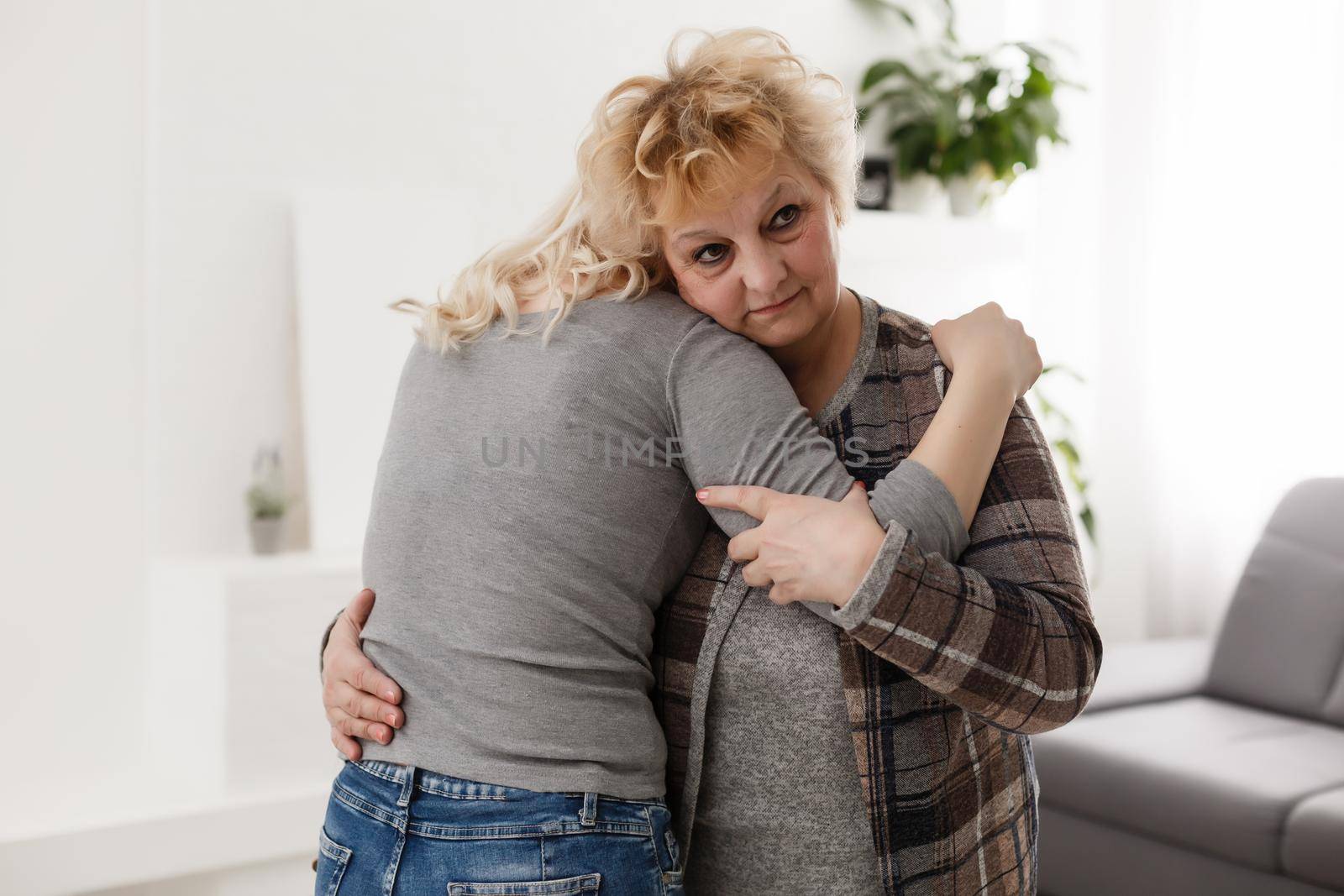 pretty woman and senior mother at home