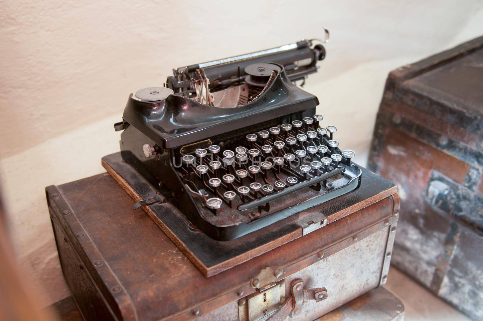 Old Antique Typewriter on a Wood Counter. old typing machine on the chest