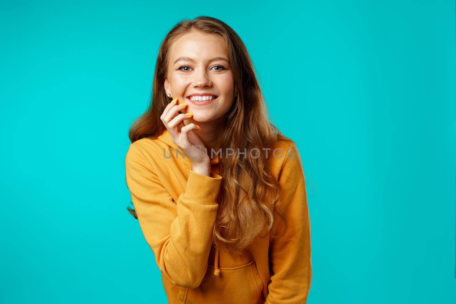 Portrait of a young beautiful happy woman smiling close up