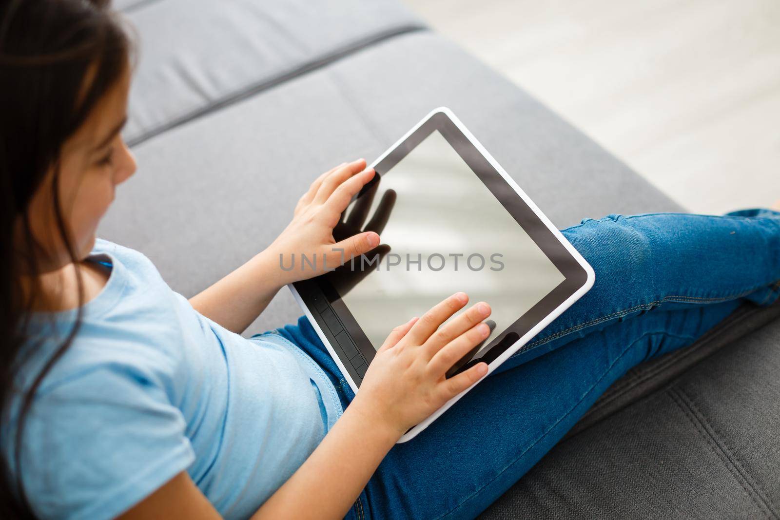 education, technology and internet concept - beautiful student girl playing with tablet pc