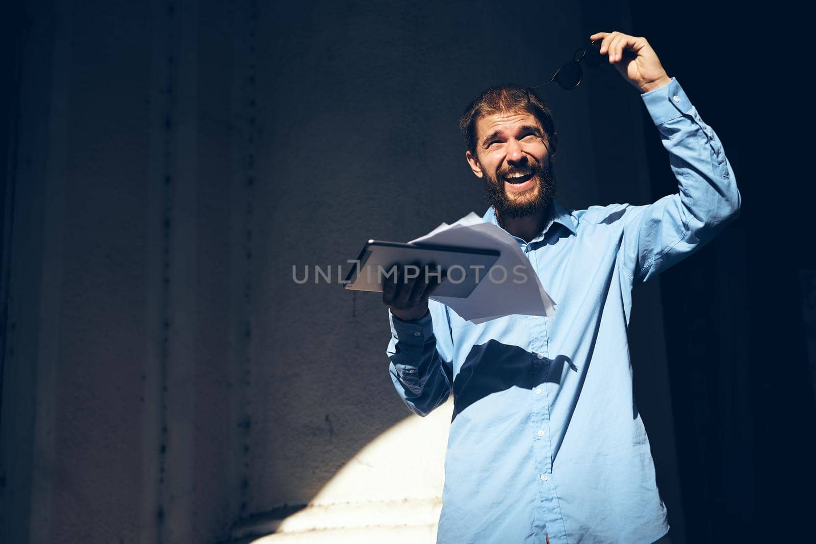 manager with glasses in his hands on the street. High quality photo