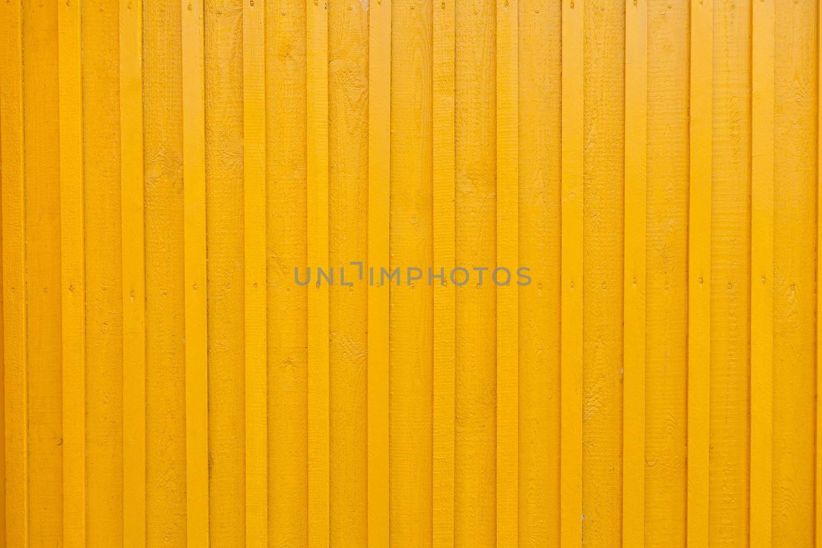Yellow Wooden Tabby Textured wall Background. wall of the wooden house is painted yellow. painted vertical yellow wooden rendering wall background. wall design