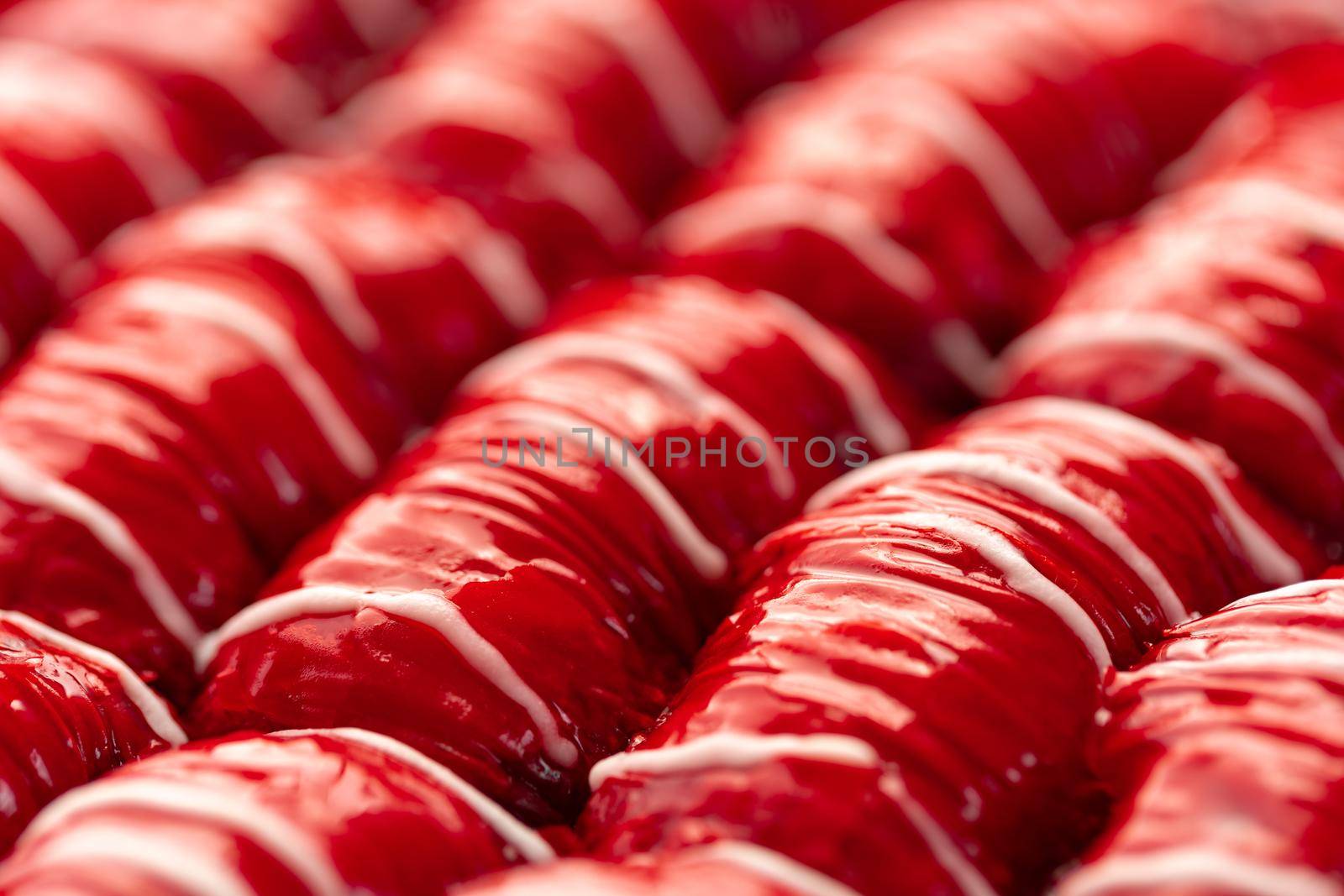 Red colored Turkish dessert baklava placed in rows, for background