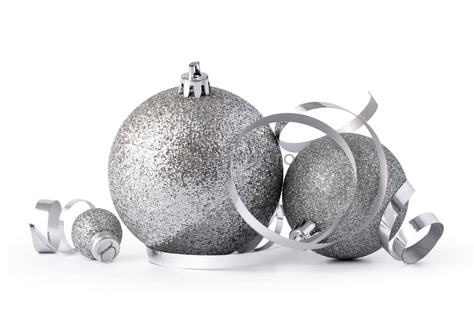 Silver sparkling Christmas baubles isolated on white background, close up