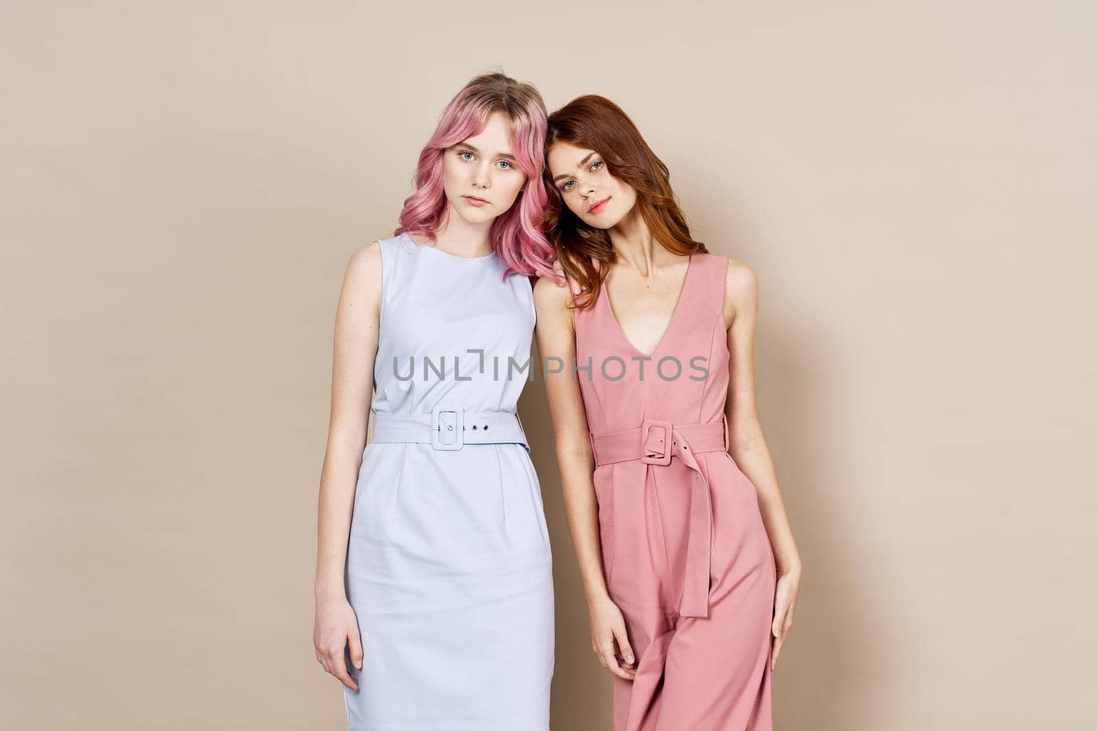 two women in fashionable clothes posing model decoration. High quality photo