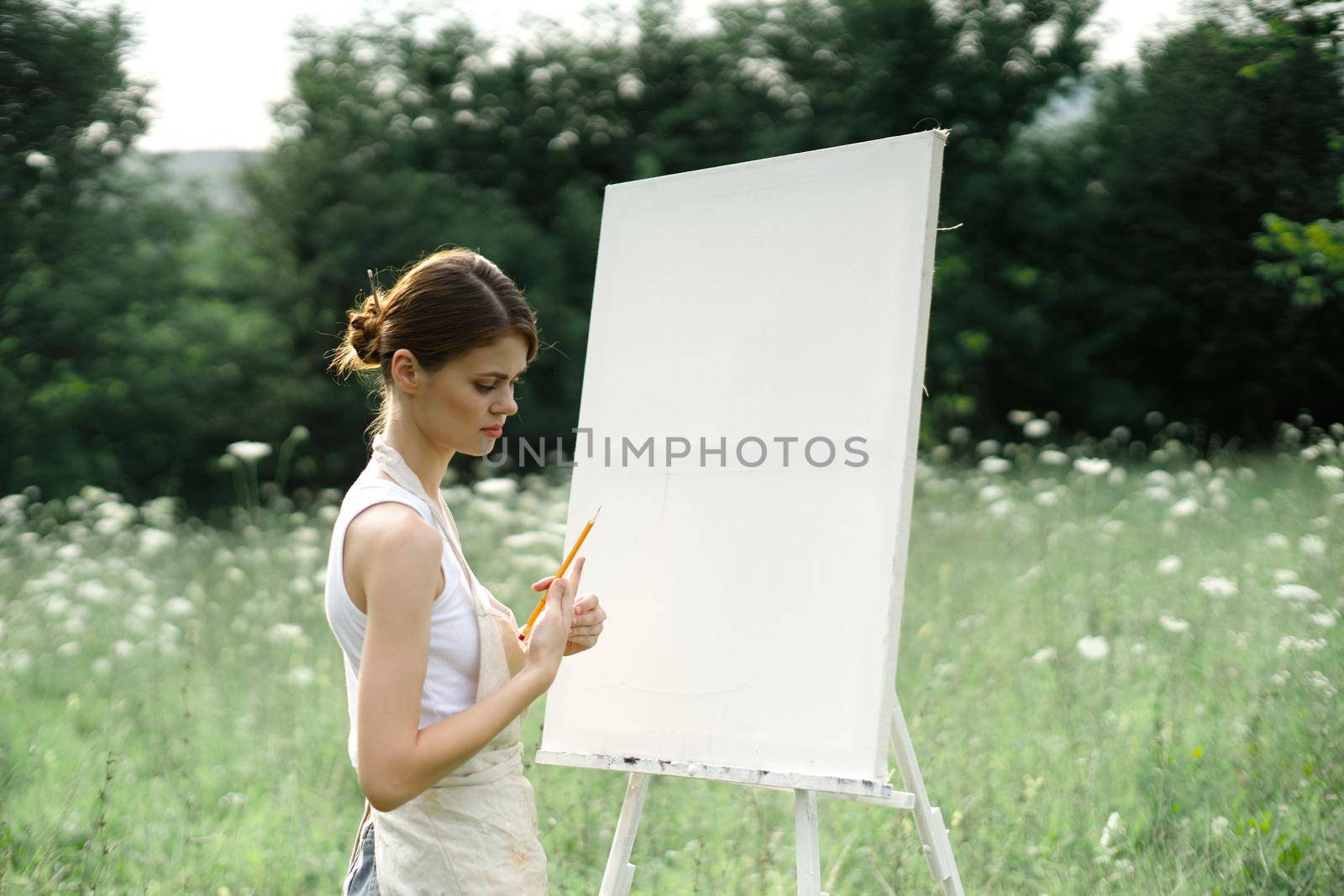woman outdoors painting a picture creative art landscape by Vichizh
