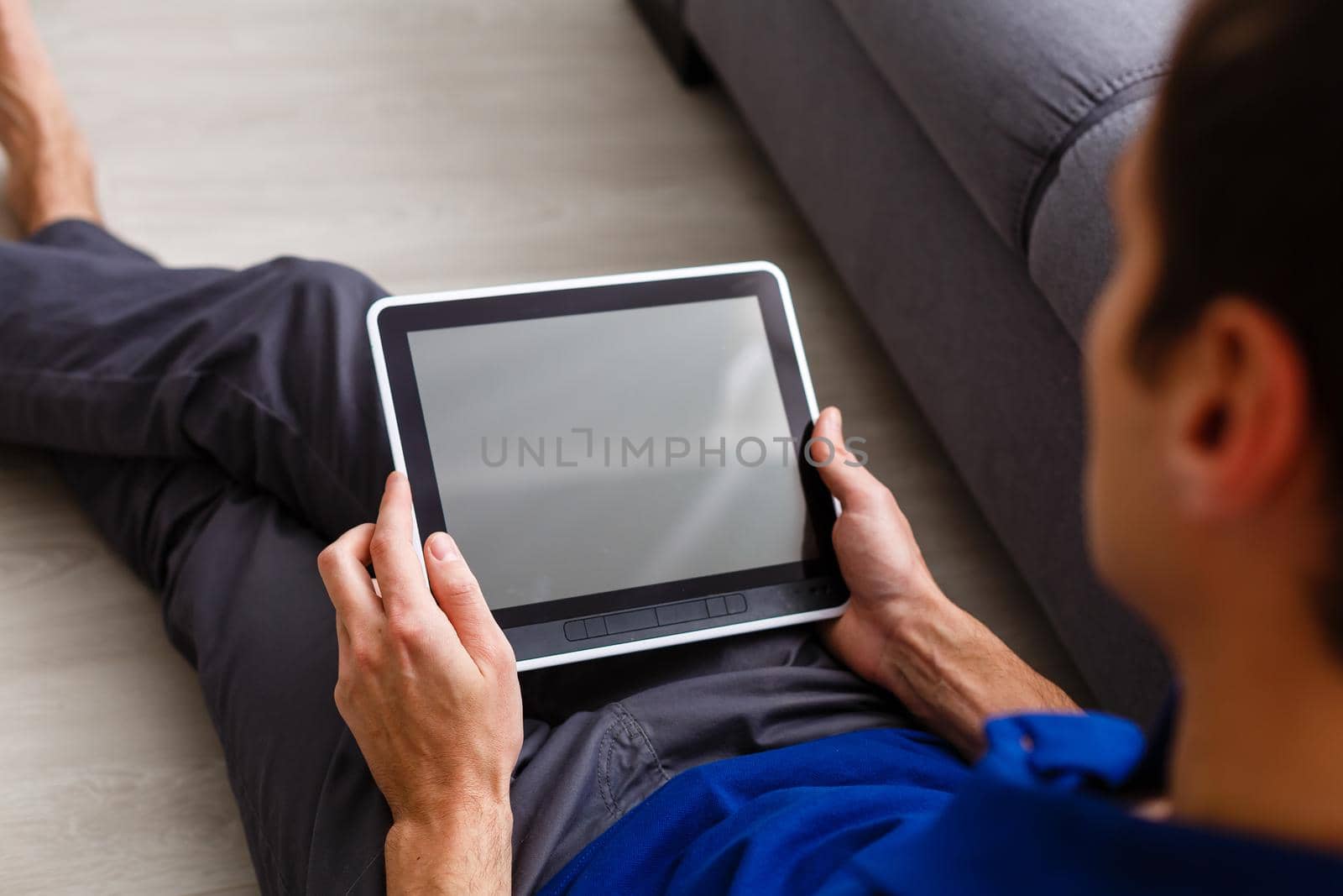 businessman holding a tablet computer with system clever house