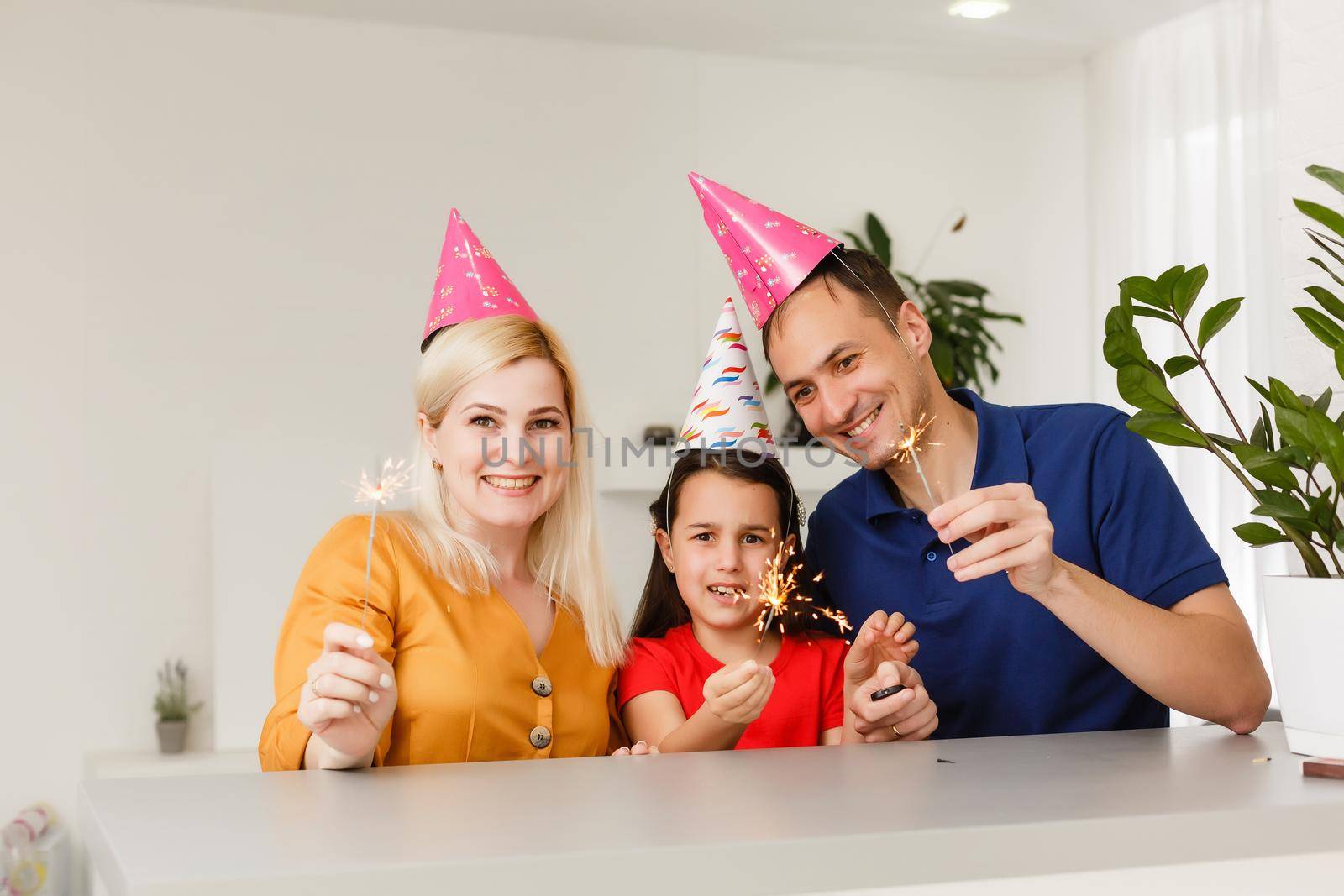 Happy family celebrating birthday via internet in quarantine time, self-isolation and family values, online birthday party