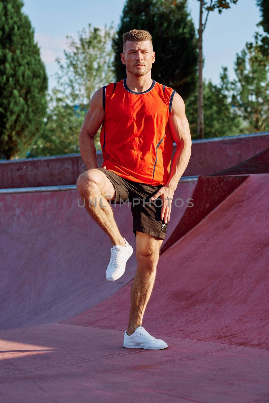 sports man on the playground in the park workout. High quality photo