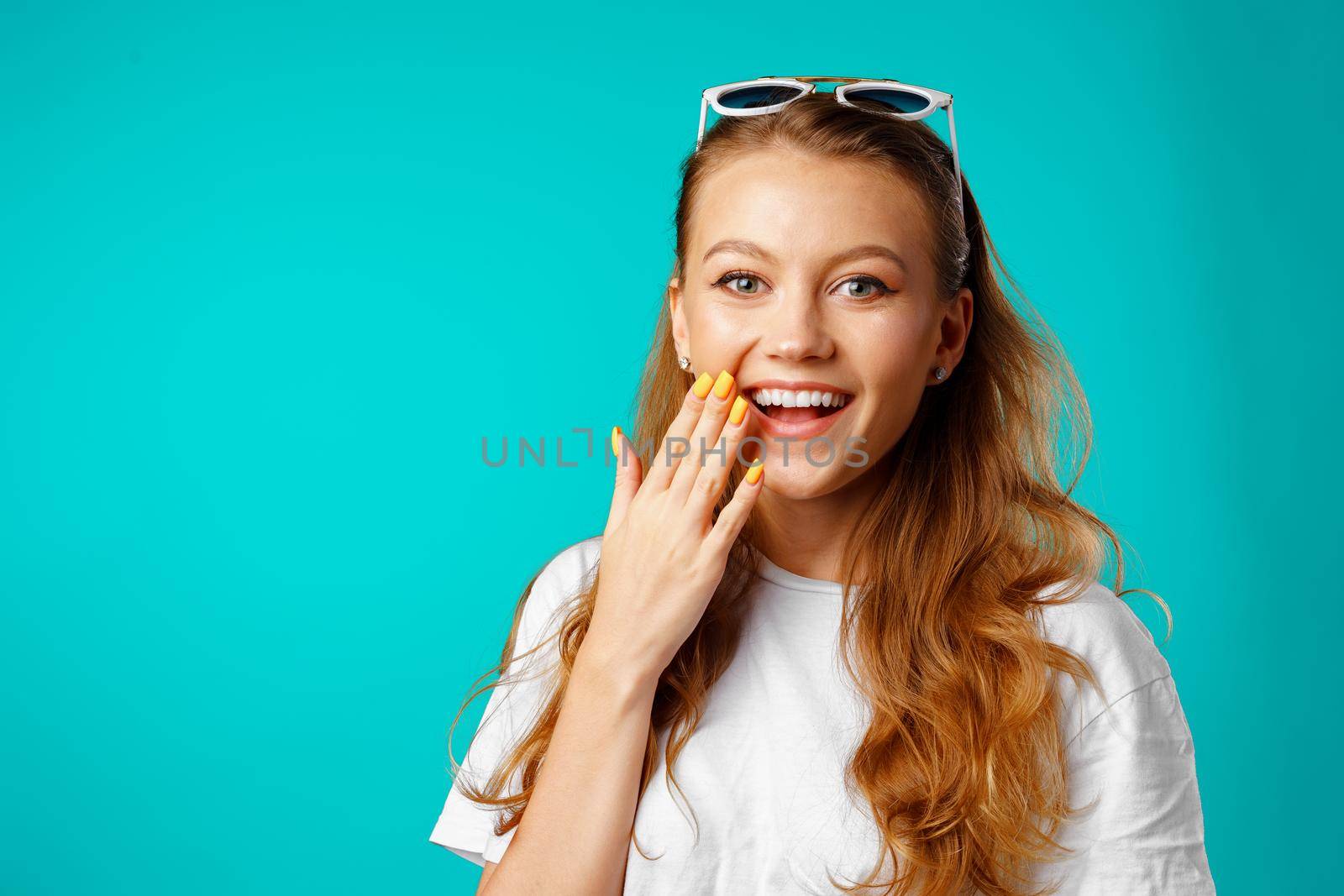 Young attractive cheerful girl laughing with joy close up