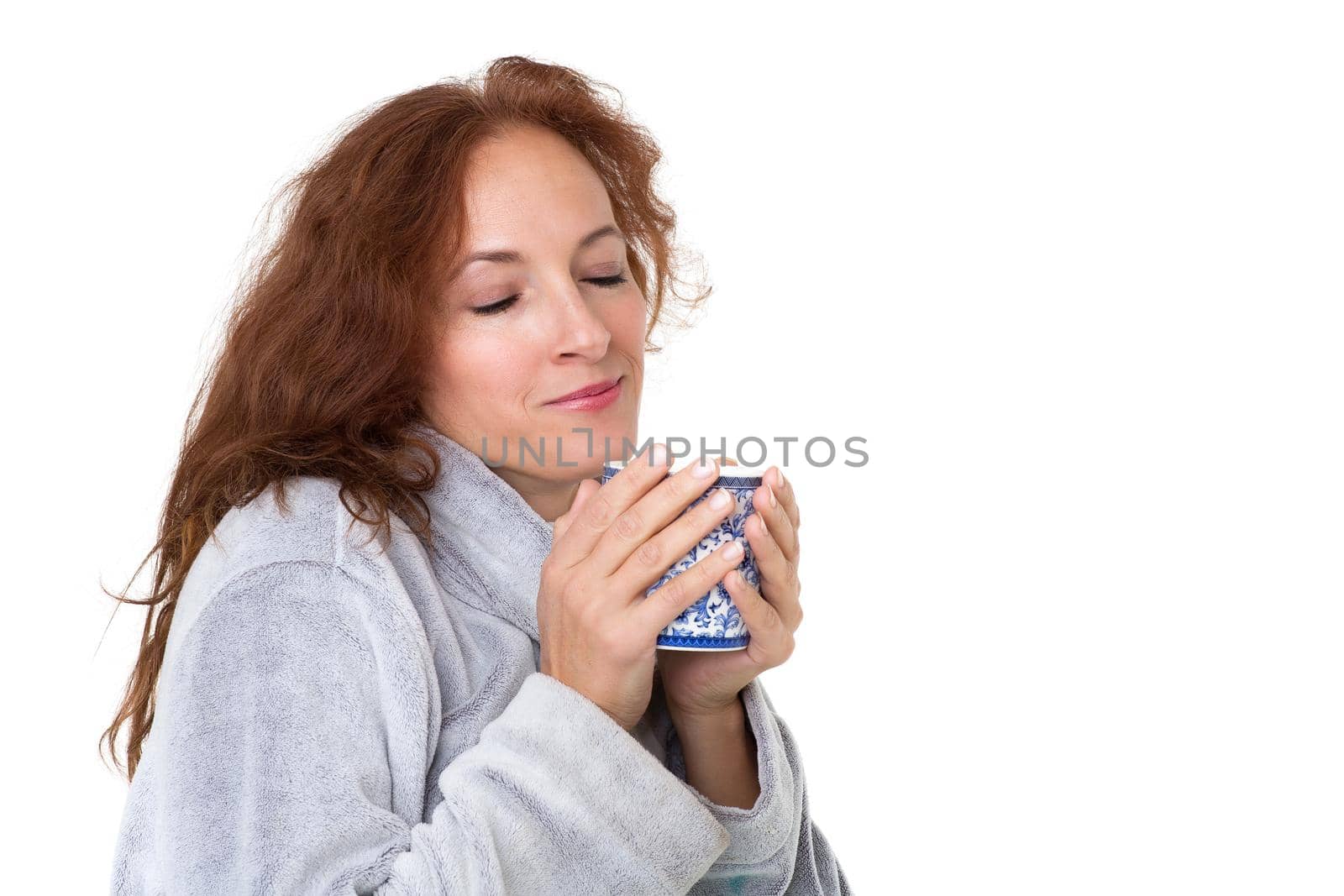 Smiling woman holding porcelain mug. Photo session in the studio by kolesnikov_studio