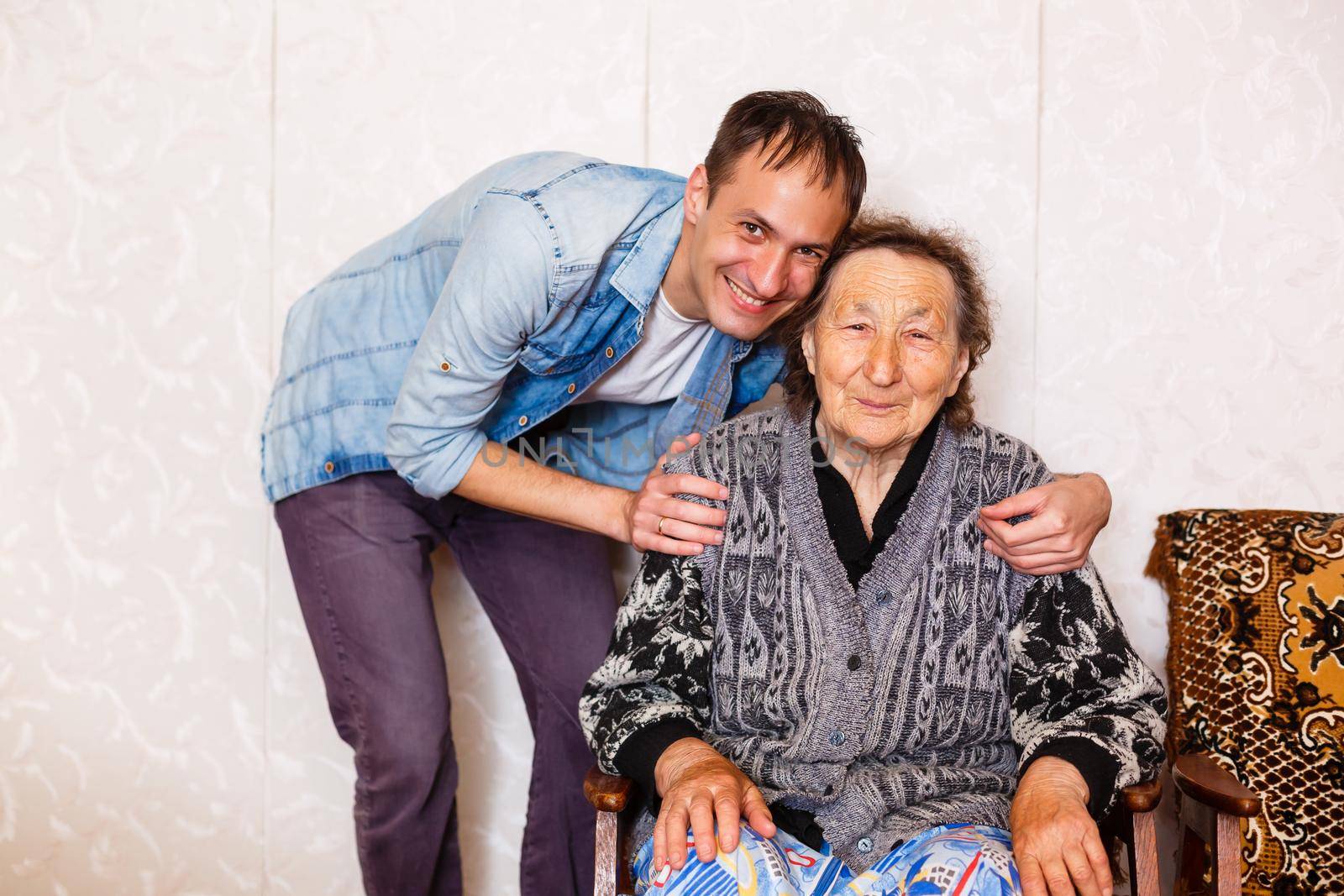 Closeup of elderly woman with young man