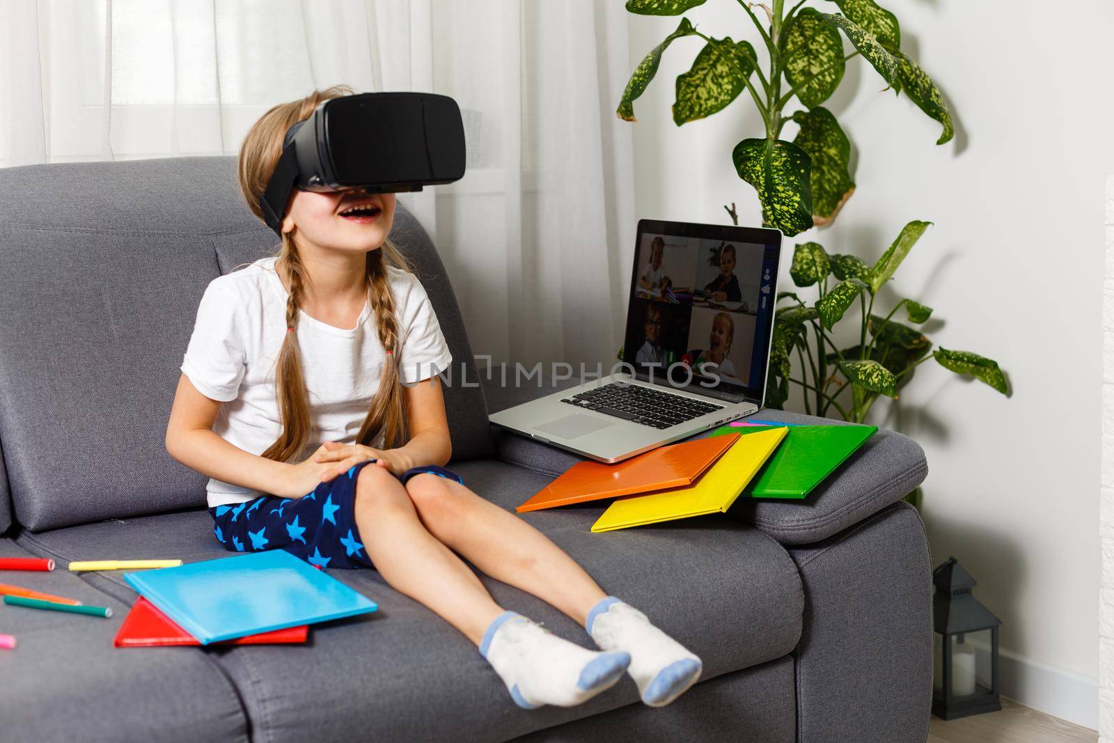 Young little girl with VR virtual reality glasses by Andelov13