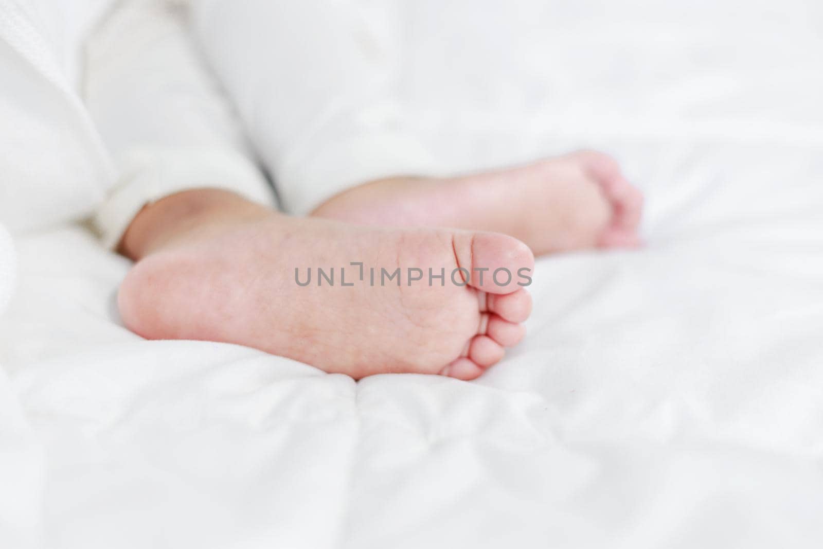 little baby feet on a bed 