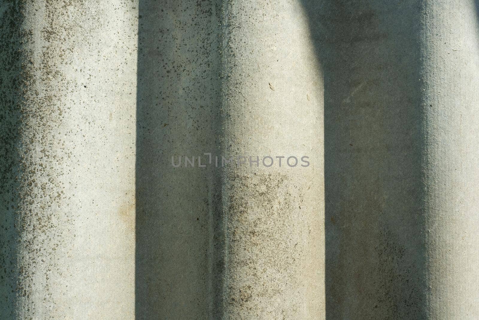 Grey textured concrete cement wall closeup background,