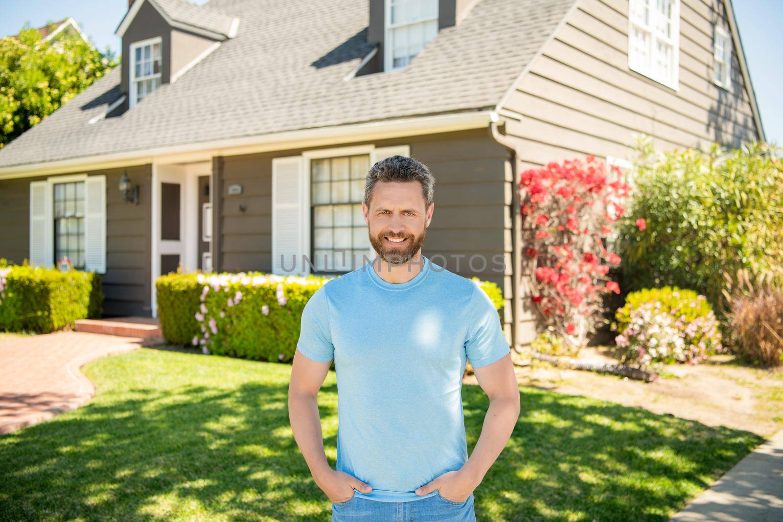 happy mature man standing outdoor at house, owner by RedFoxStudio