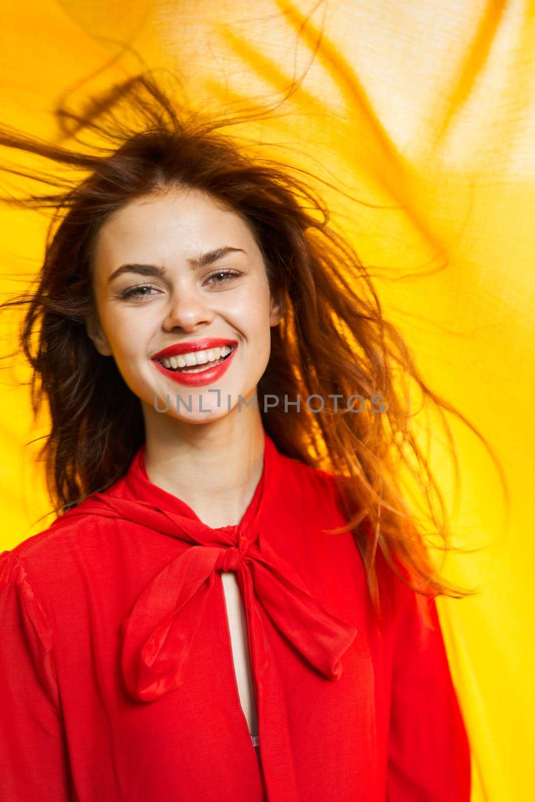 cheerful woman in red dress makeup yellow cloth posing by Vichizh