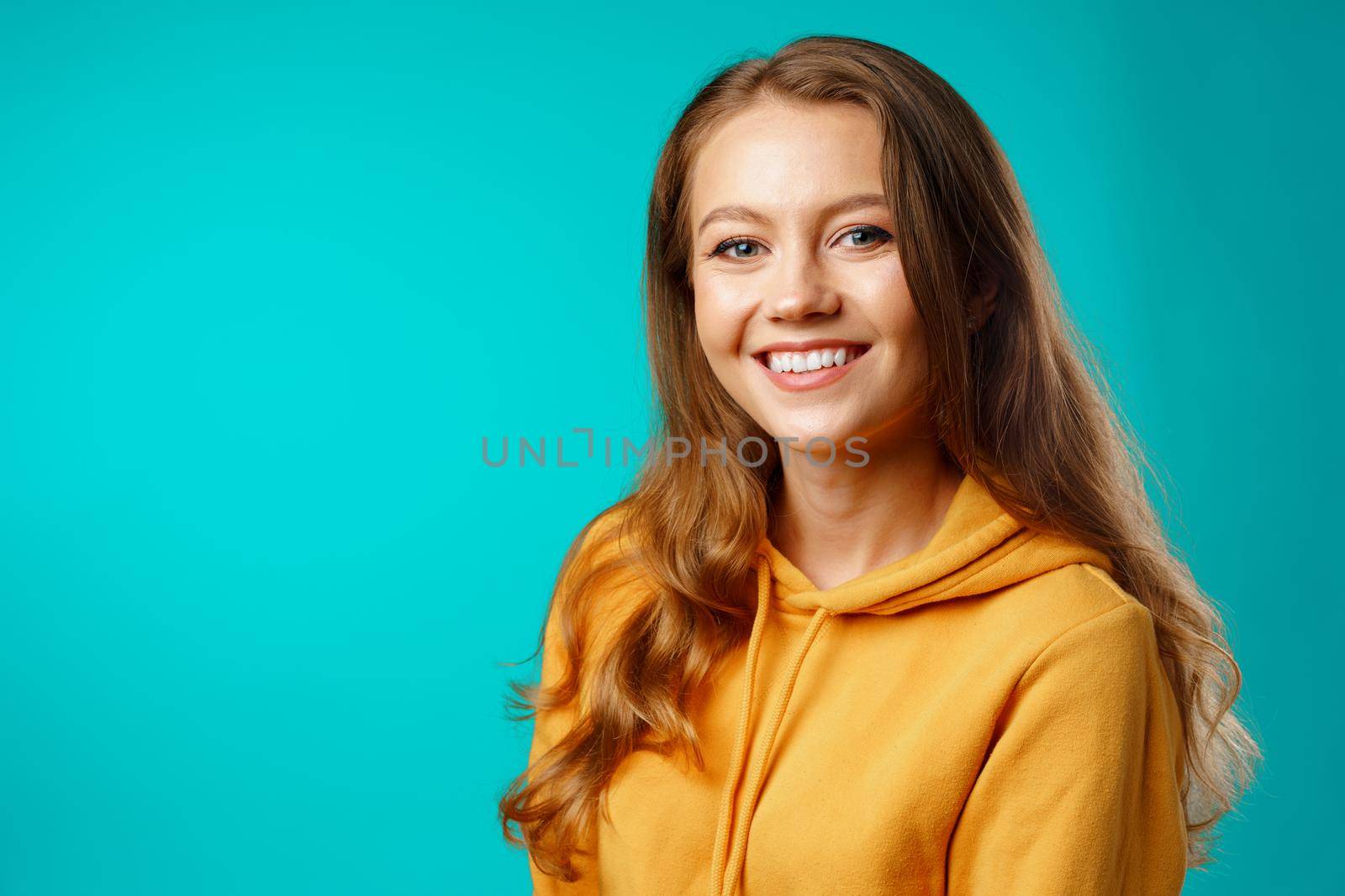 Portrait of a young beautiful happy woman smiling close up