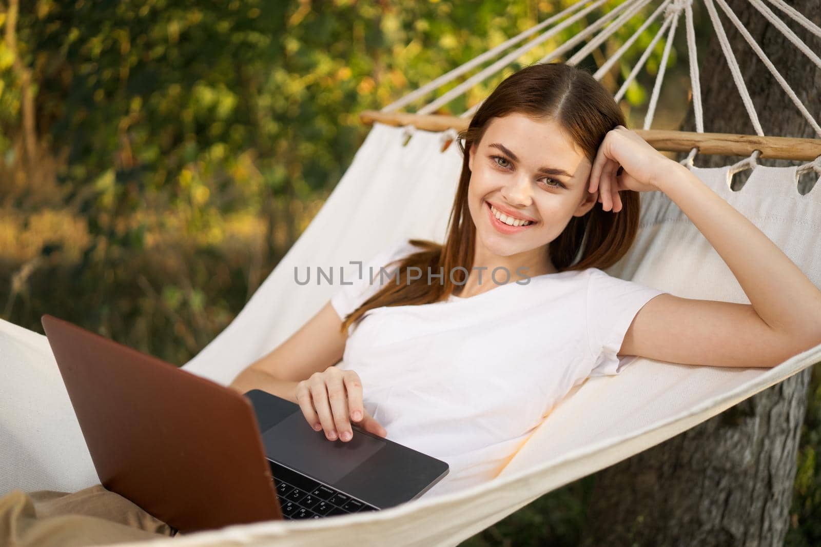 woman love with laptop on nature vacation work travel. High quality photo