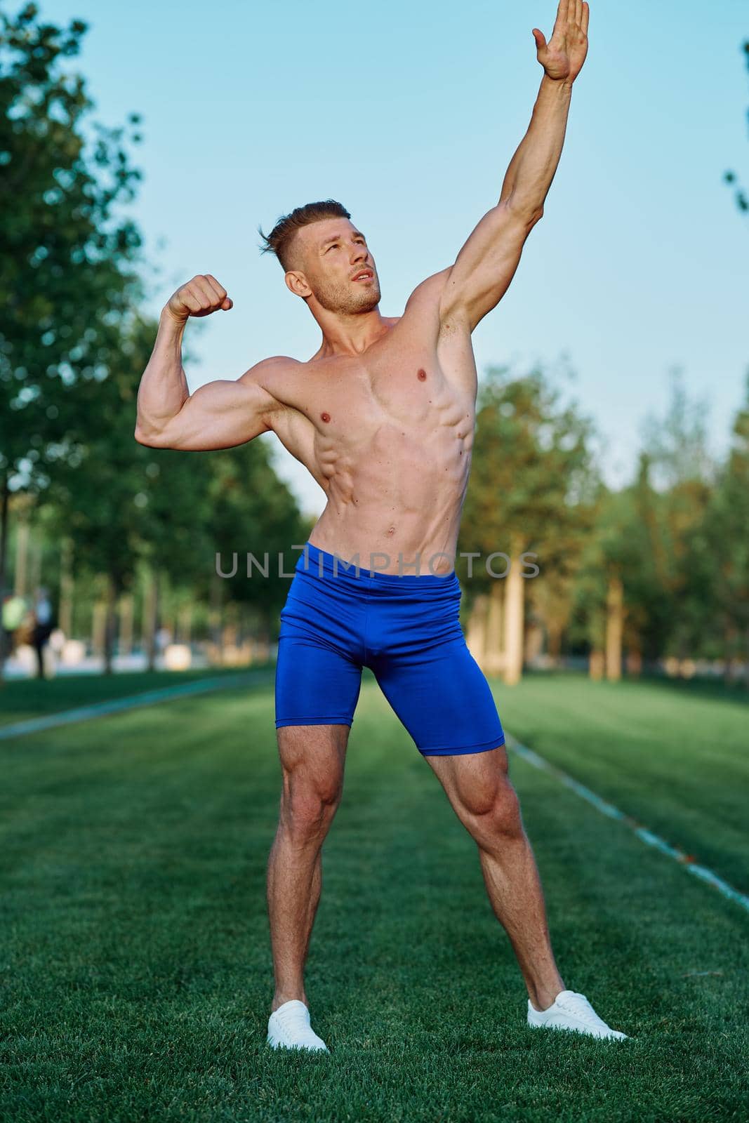 man doing exercises in the park inflated body. High quality photo