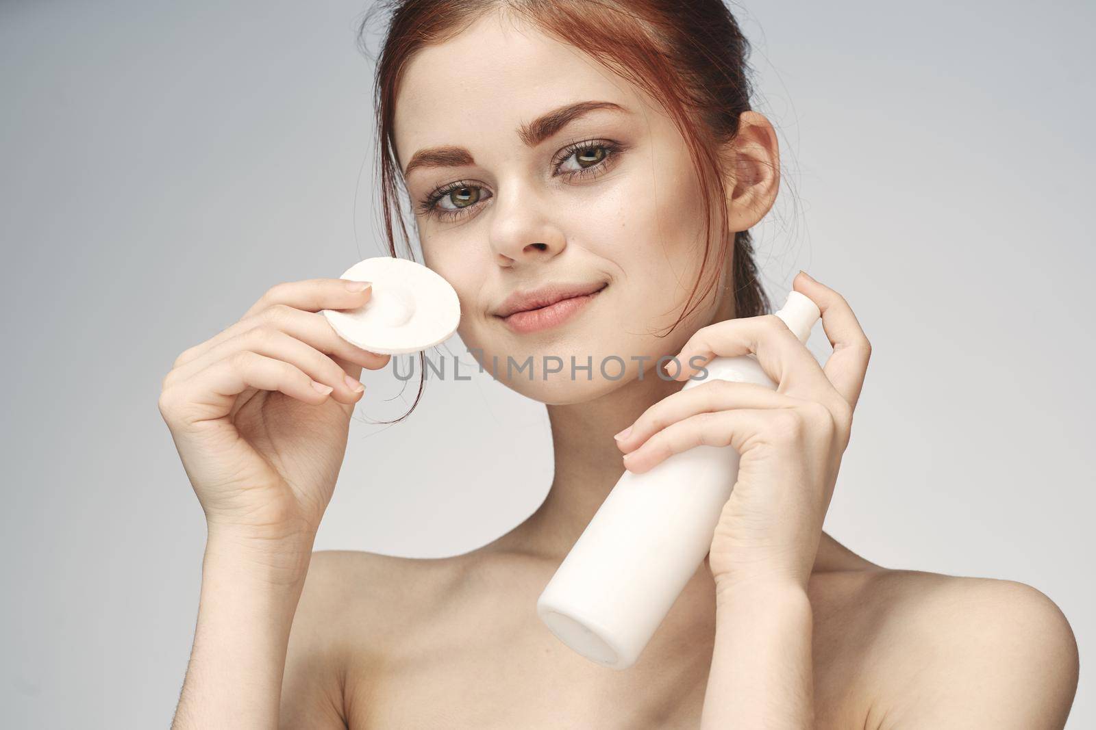 woman with bare shoulders cosmetics procedures skin care cream by Vichizh