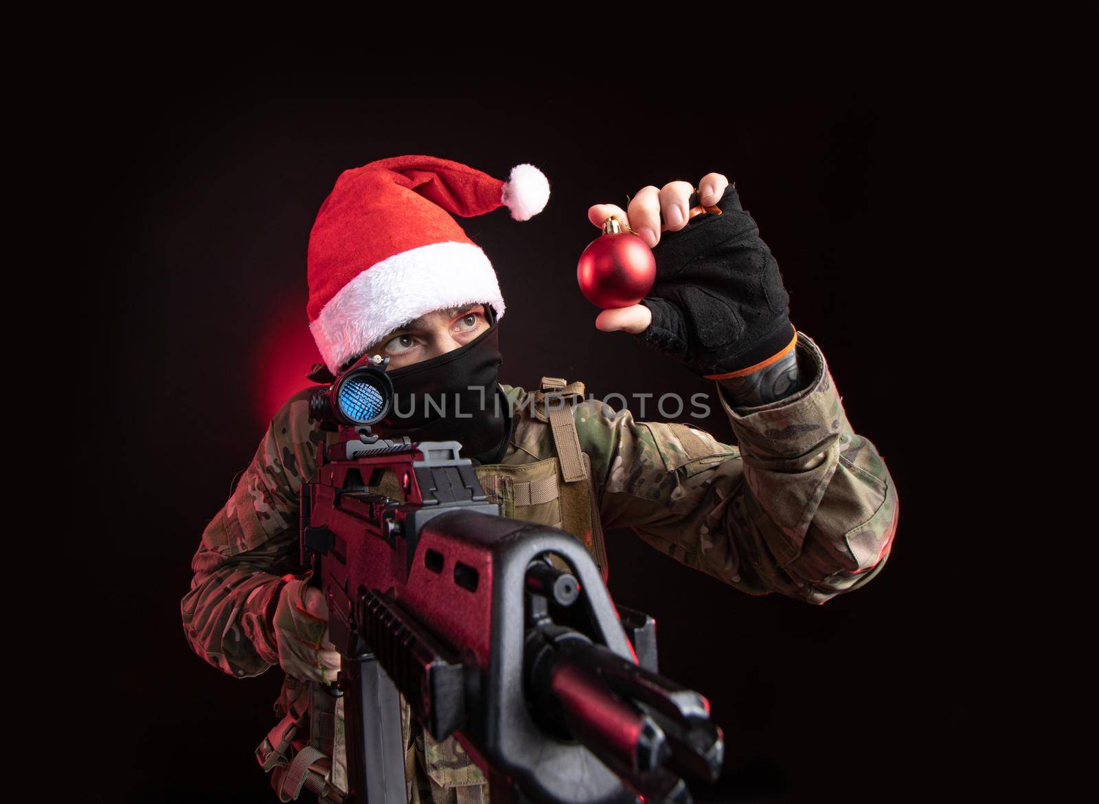 the girl in military overalls airsoft posing with a gun in his hands on a dark background in the haze in neon light by Rotozey